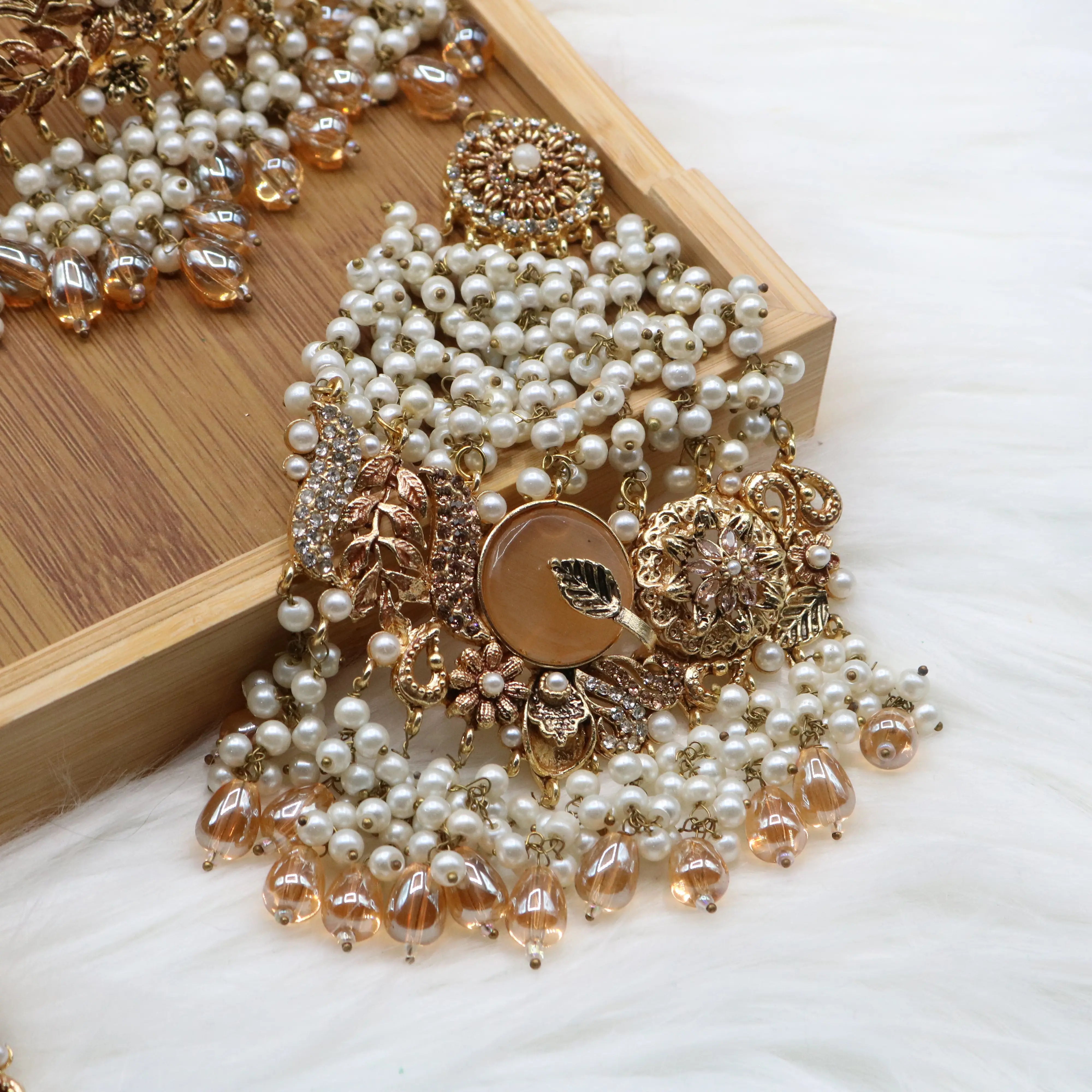 jhoomer view of Gold pearl and champagne Pakistani bridal choker set with jhoomer