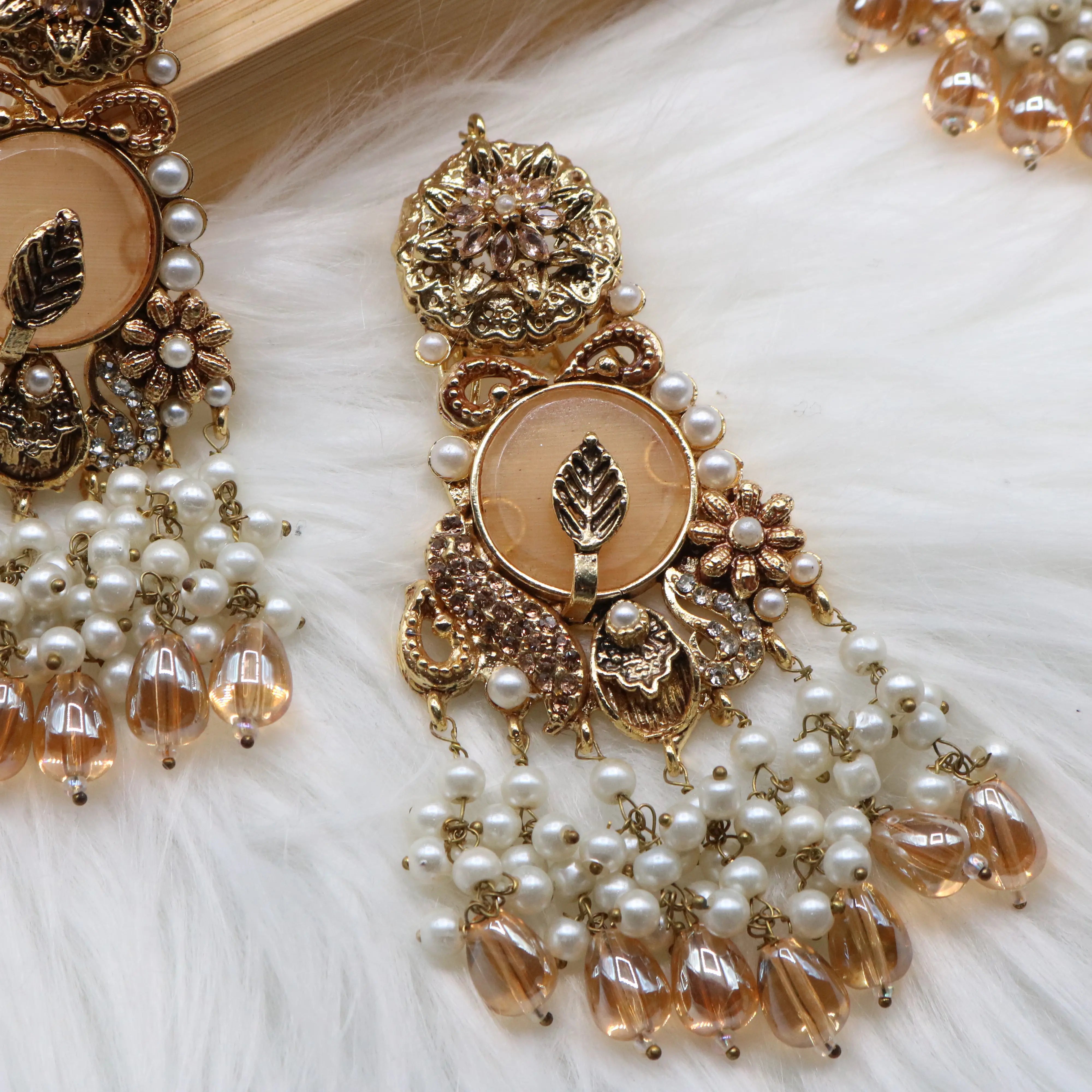 earring view of Gold pearl and champagne Pakistani bridal choker set with jhoomer