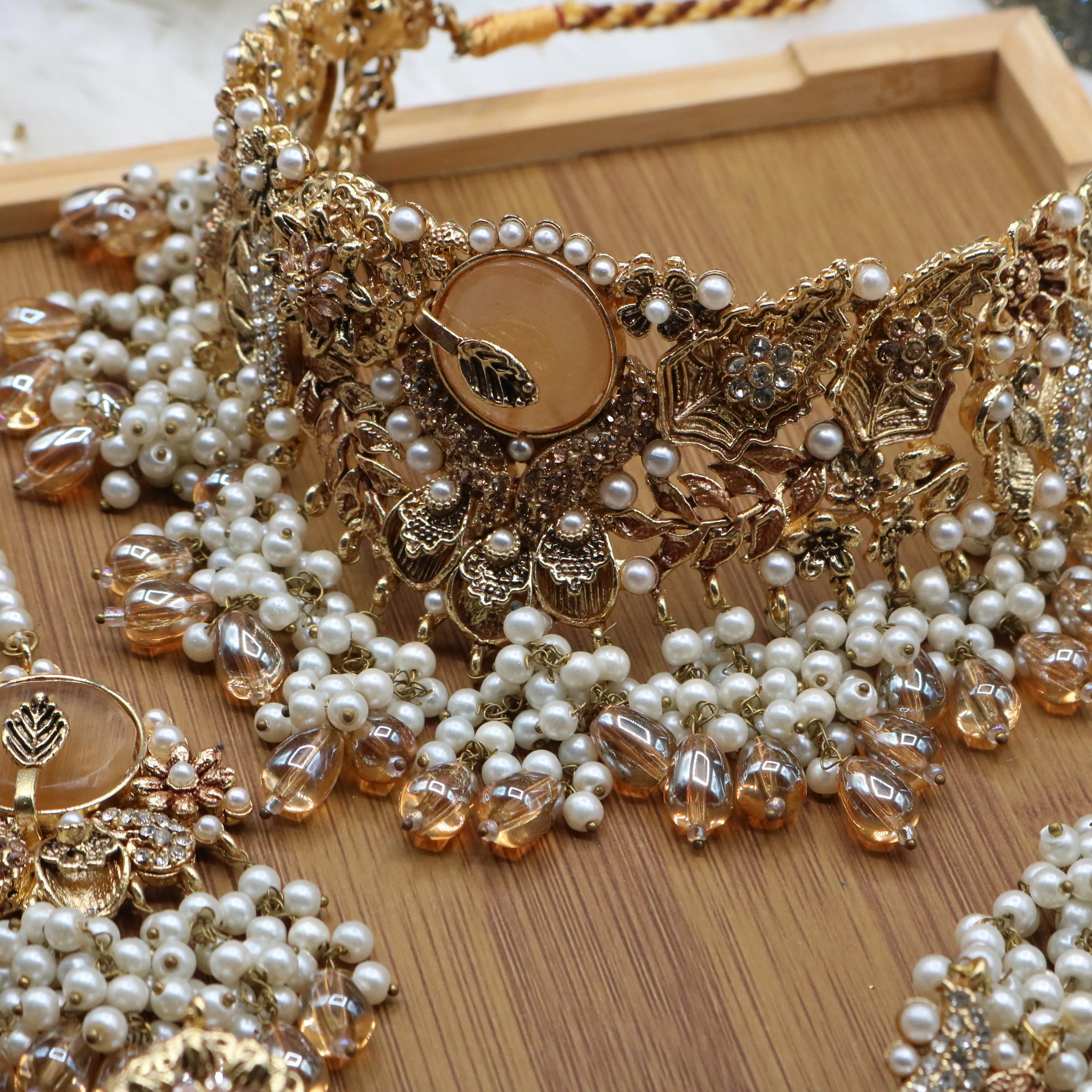 necklace view of Gold pearl and champagne Pakistani bridal choker set with jhoomer