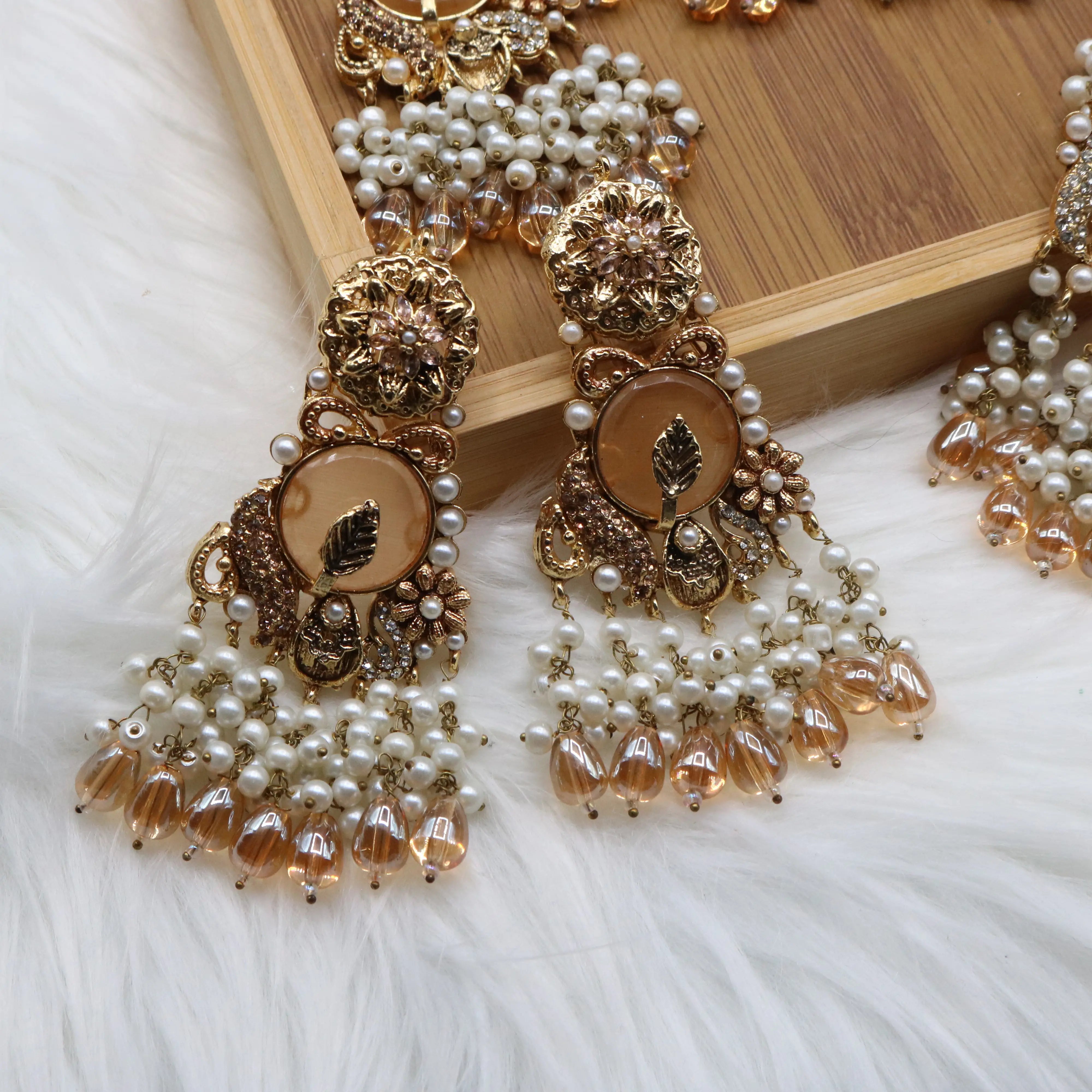 earrings view of Gold pearl and champagne Pakistani bridal choker set with jhoomer