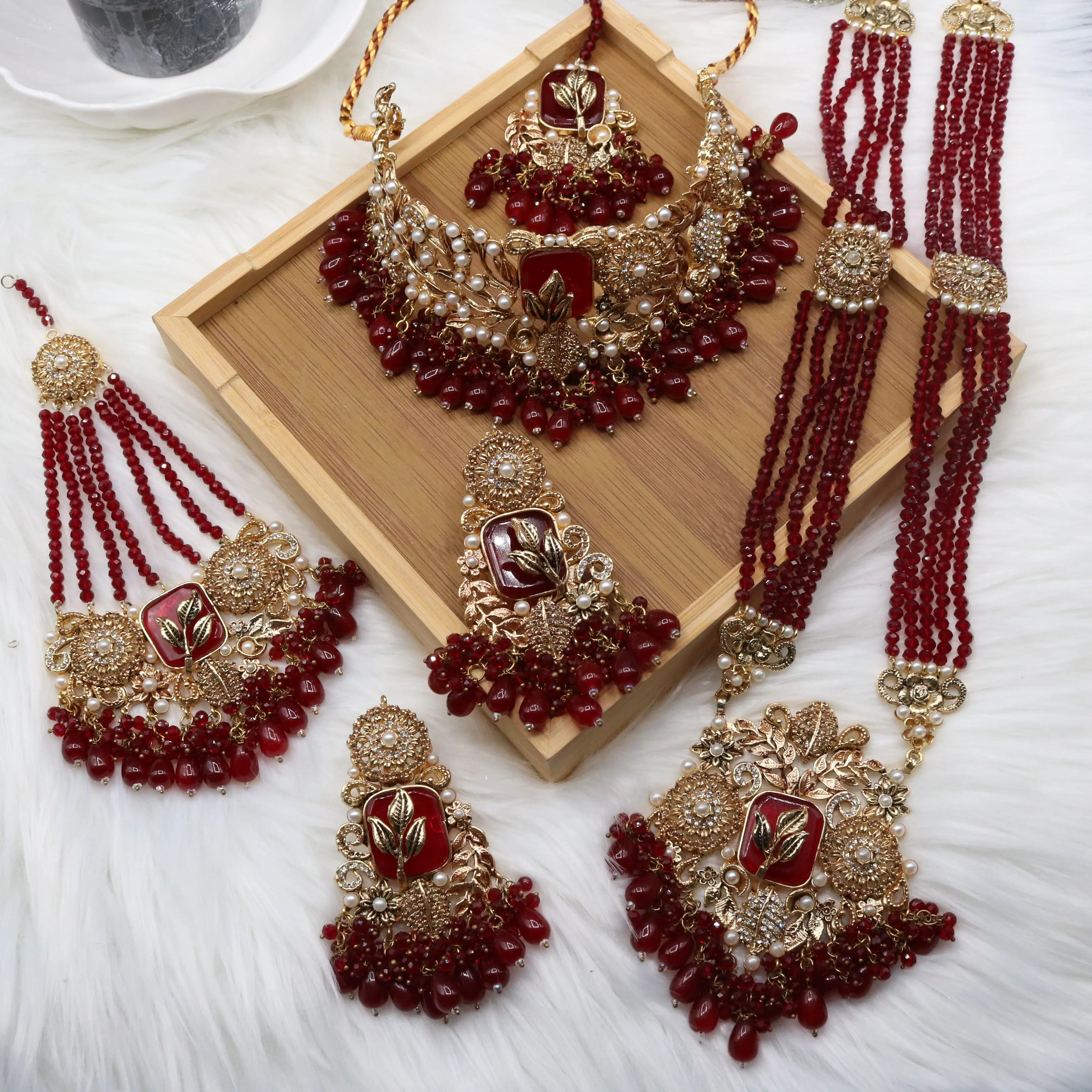 Gold-plated Pakistani bridal set with American diamonds and red stones