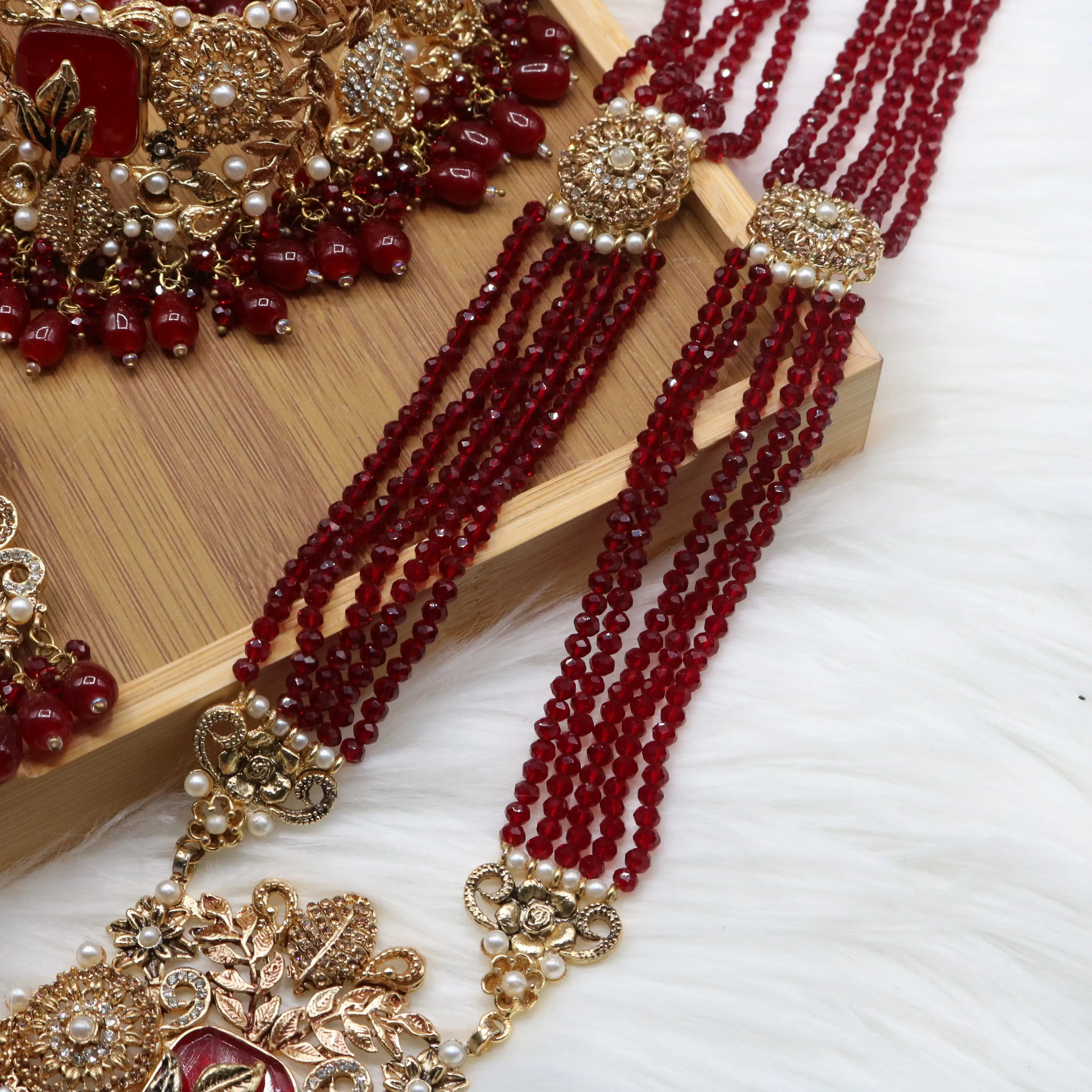 maala view of Red Pakistani bridal choker necklace with matching mala set. Gold-plated bridal set with American diamonds and red stones
