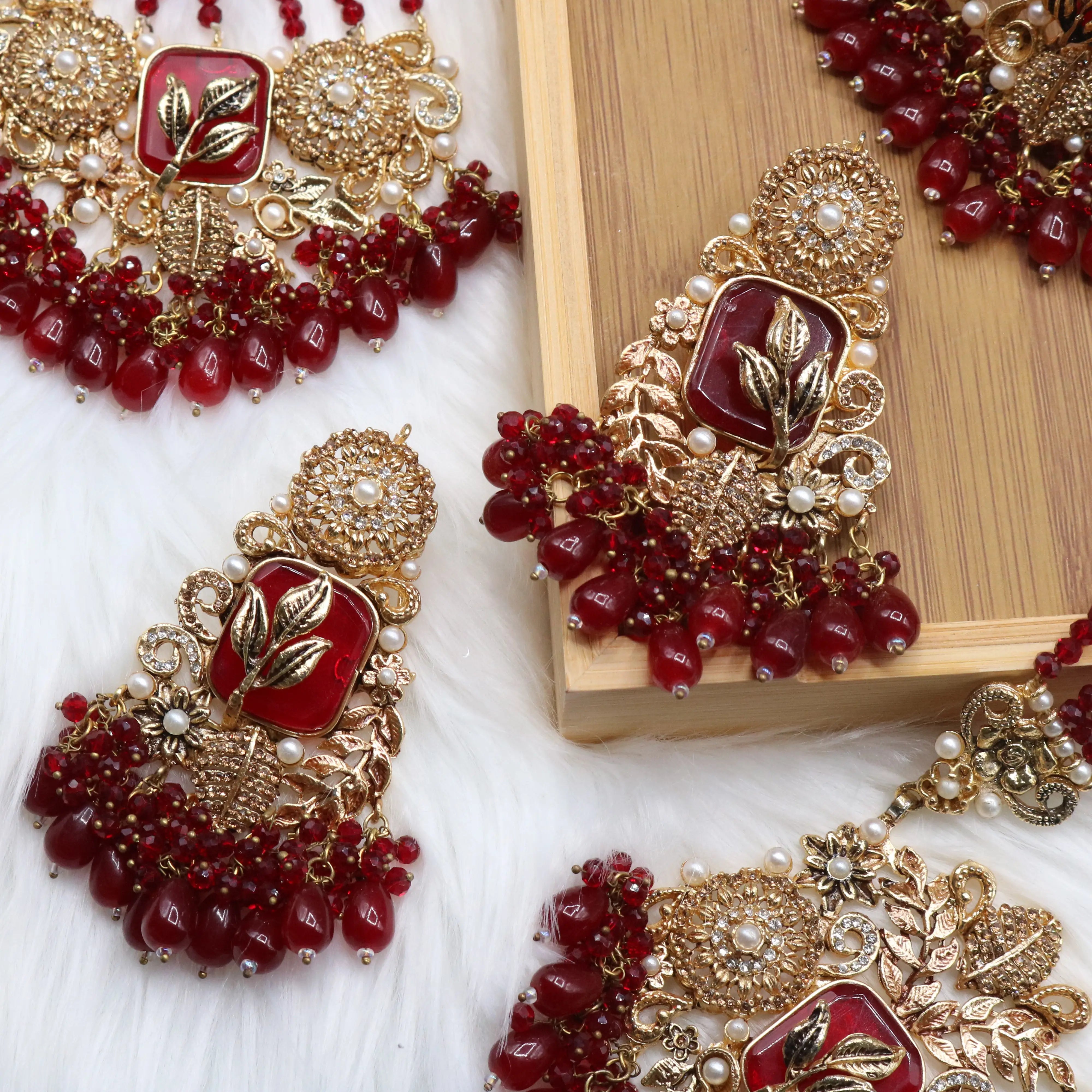 earrings view of Red Pakistani bridal choker necklace with matching mala set. Gold-plated bridal set with American diamonds and red stones