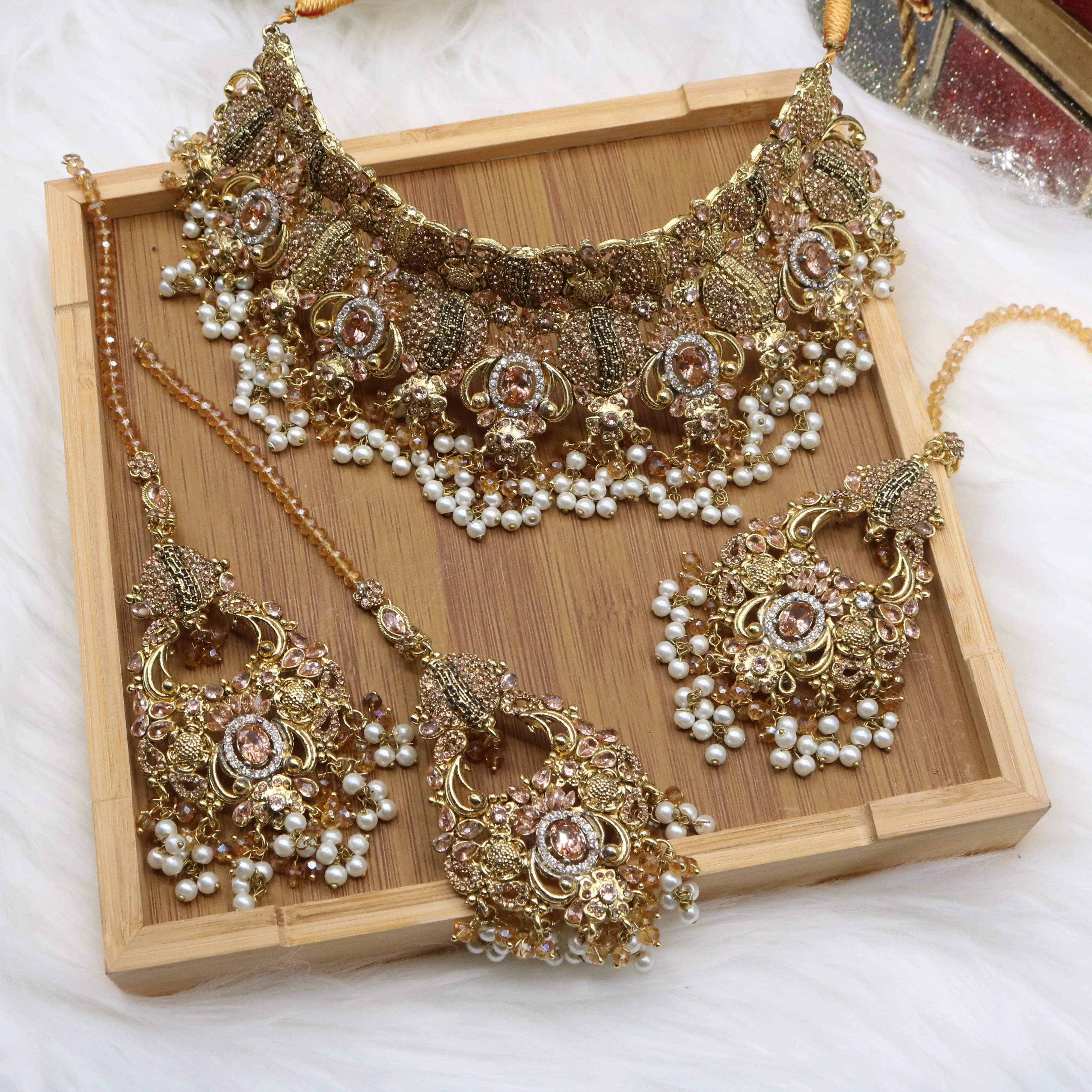 Gold-plated Pakistani bridal jewelry set with peach stones