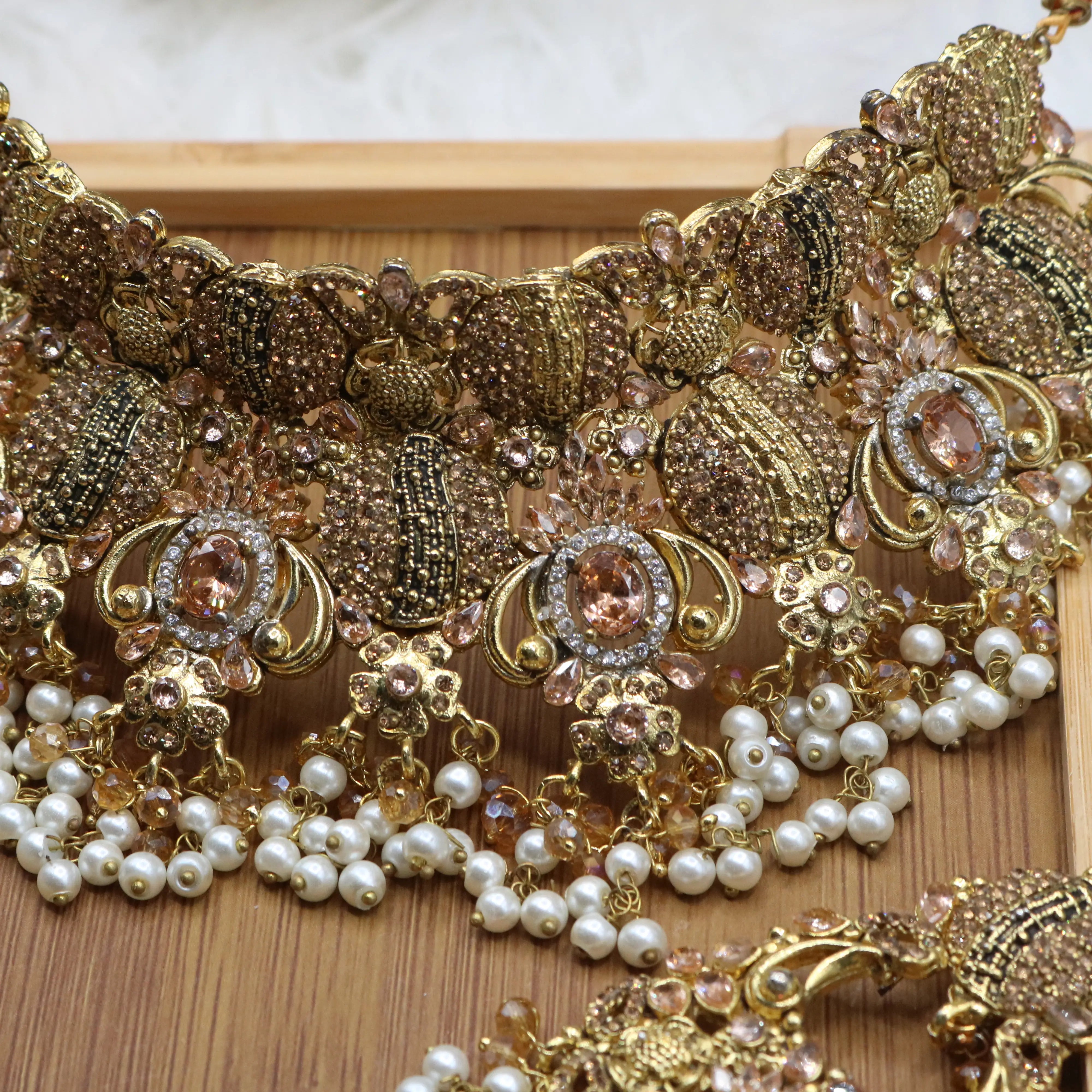 necklace view of Peach Pakistani bridal choker set with pearls and gold-plating. 
