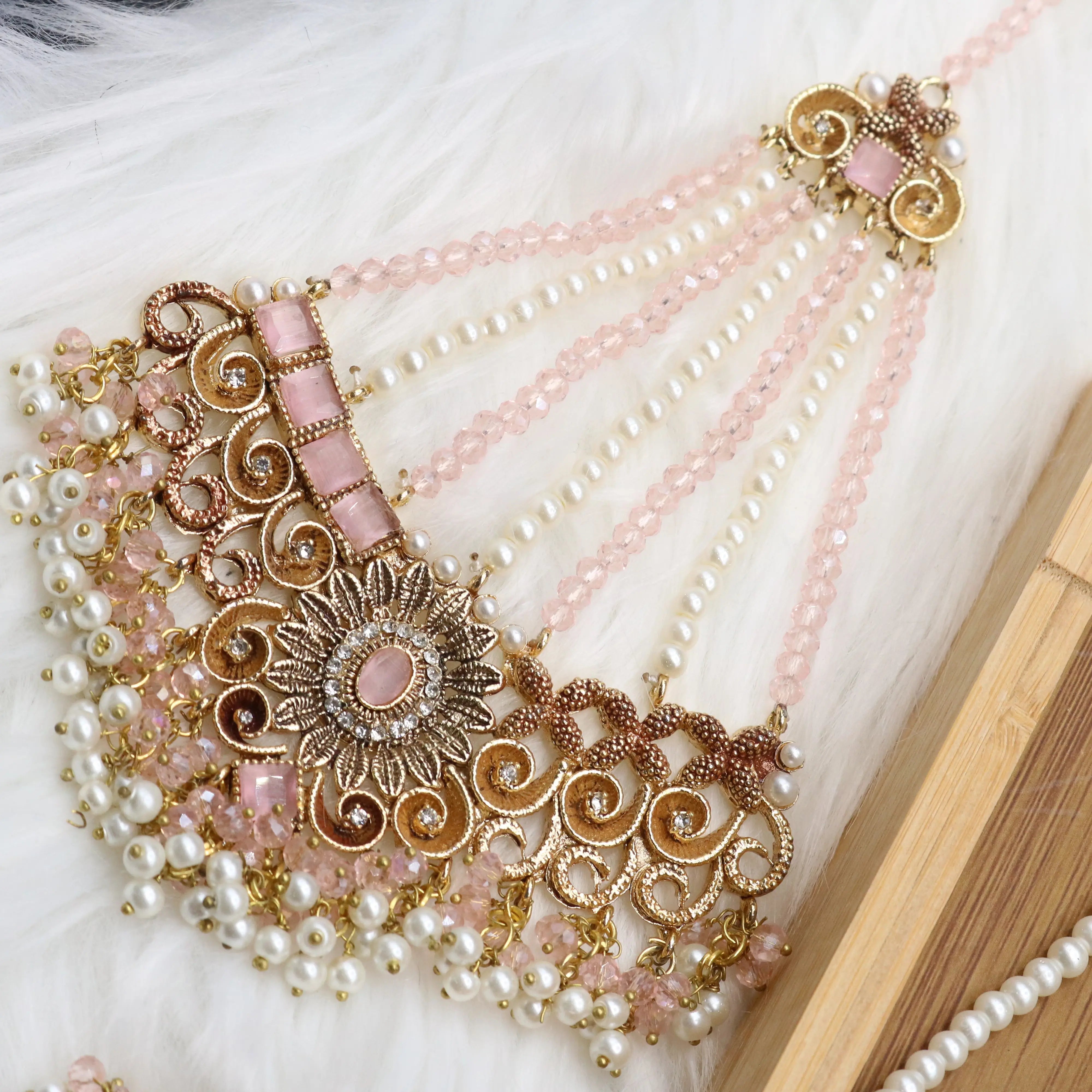 jhoomer view of Pink and pearl 6-piece Pakistani bridal jewelry set with choker, long maala, earrings, teeka & jhoomer