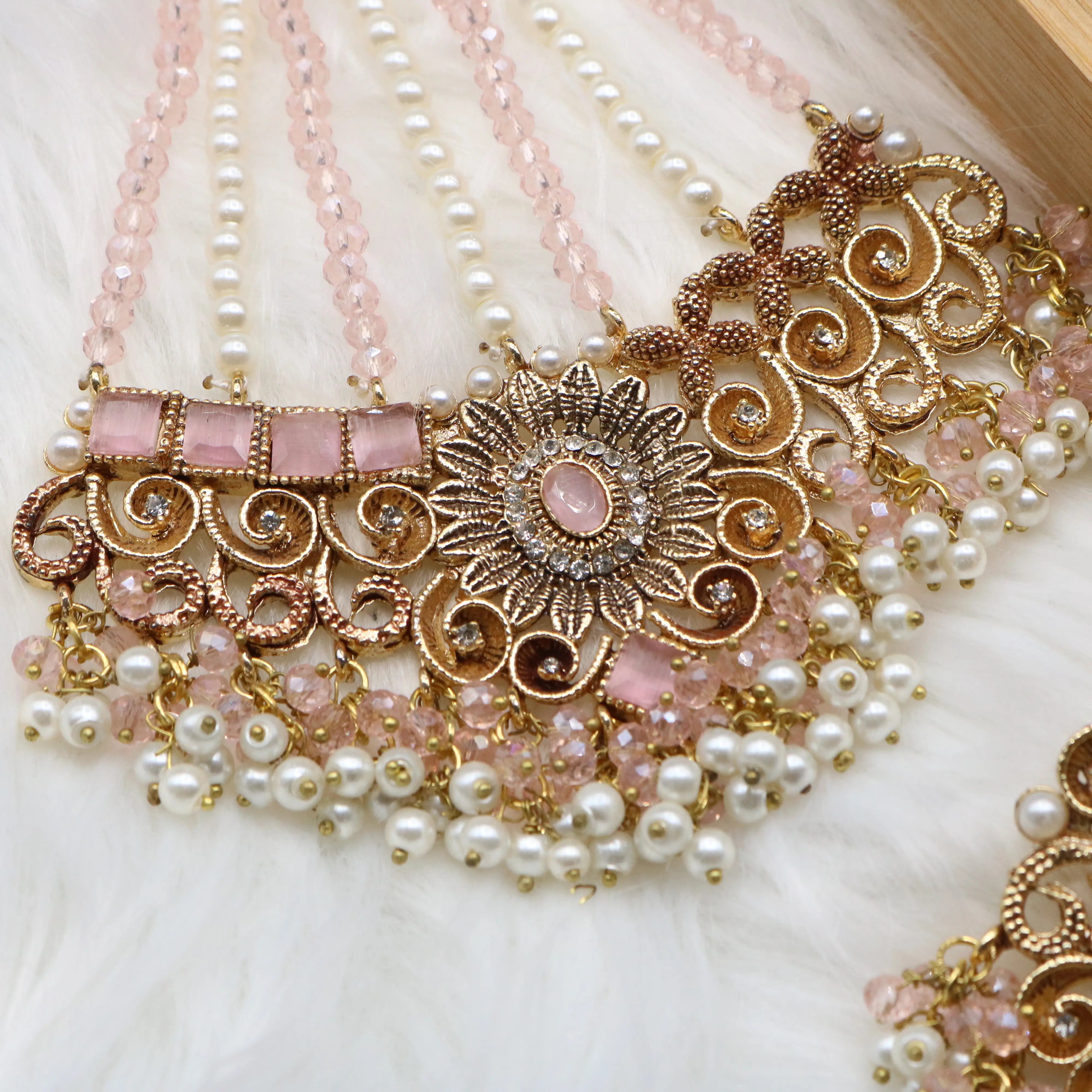 jhoomer closer view of Pink and pearl 6-piece Pakistani bridal jewelry set with choker, long maala, earrings, teeka & jhoomer