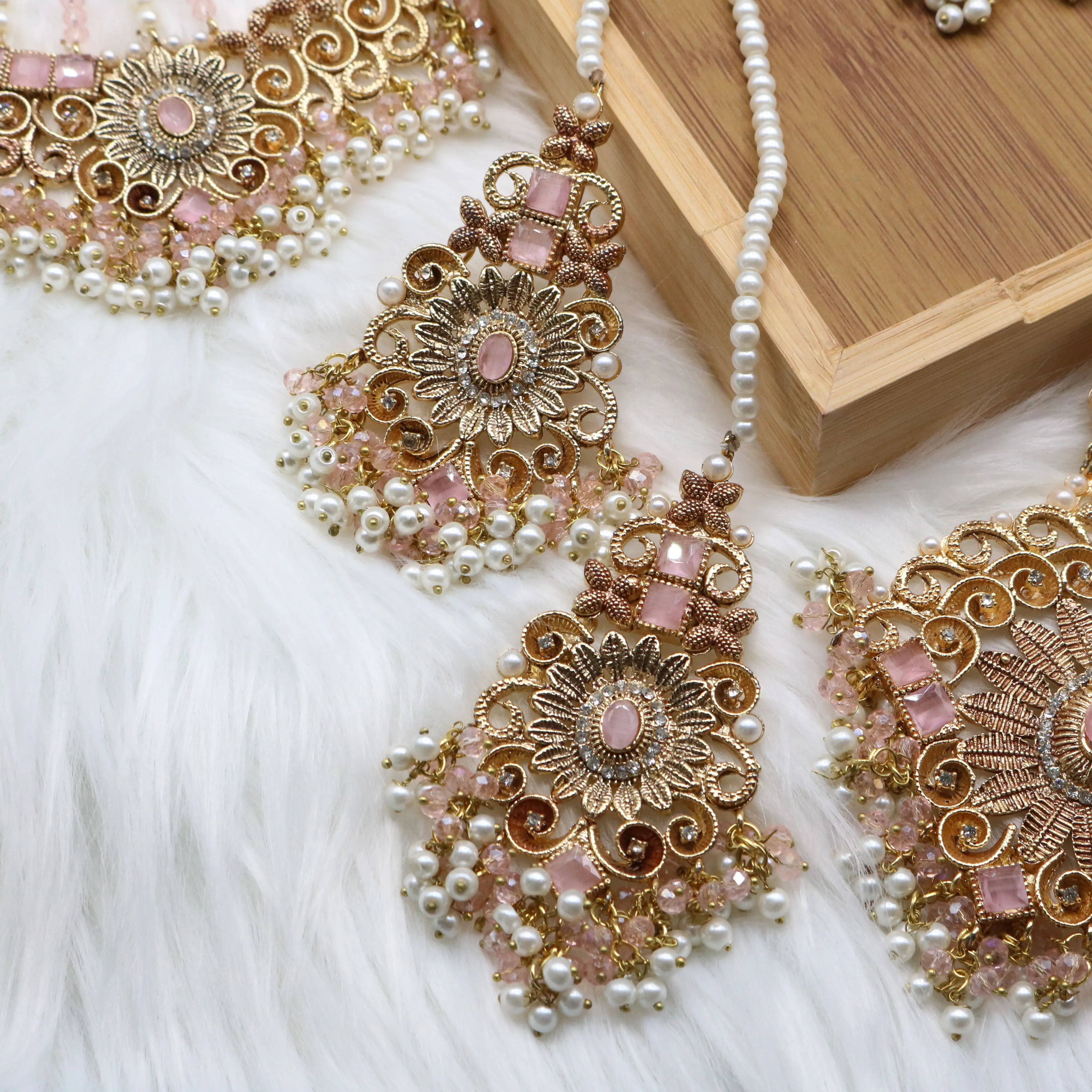 earrings view of Pink and pearl 6-piece Pakistani bridal jewelry set with choker, long maala, earrings, teeka & jhoomer