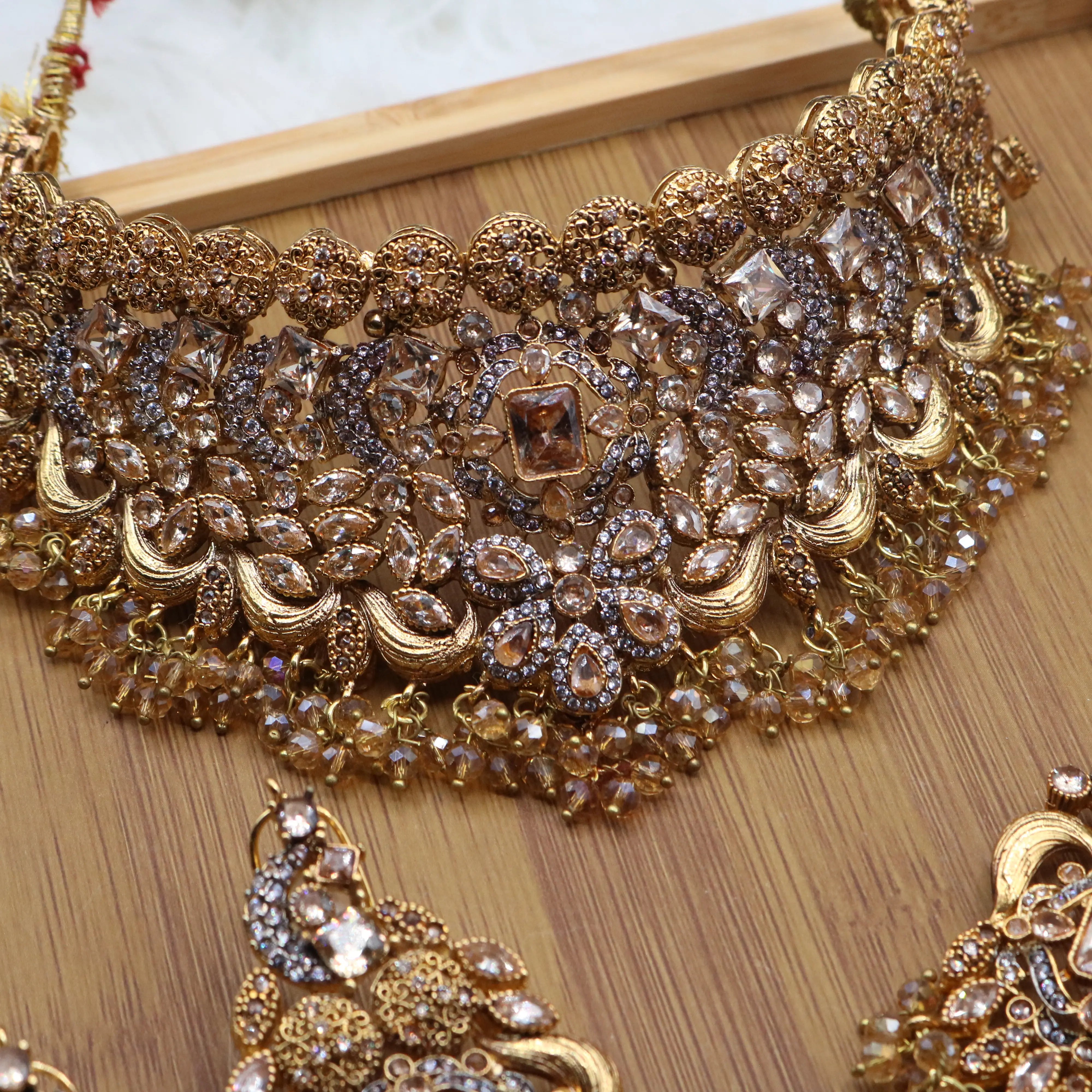 necklace view of Champagne gold Pakistani bridal choker jewelry set with earrings, teeka & jhoomer