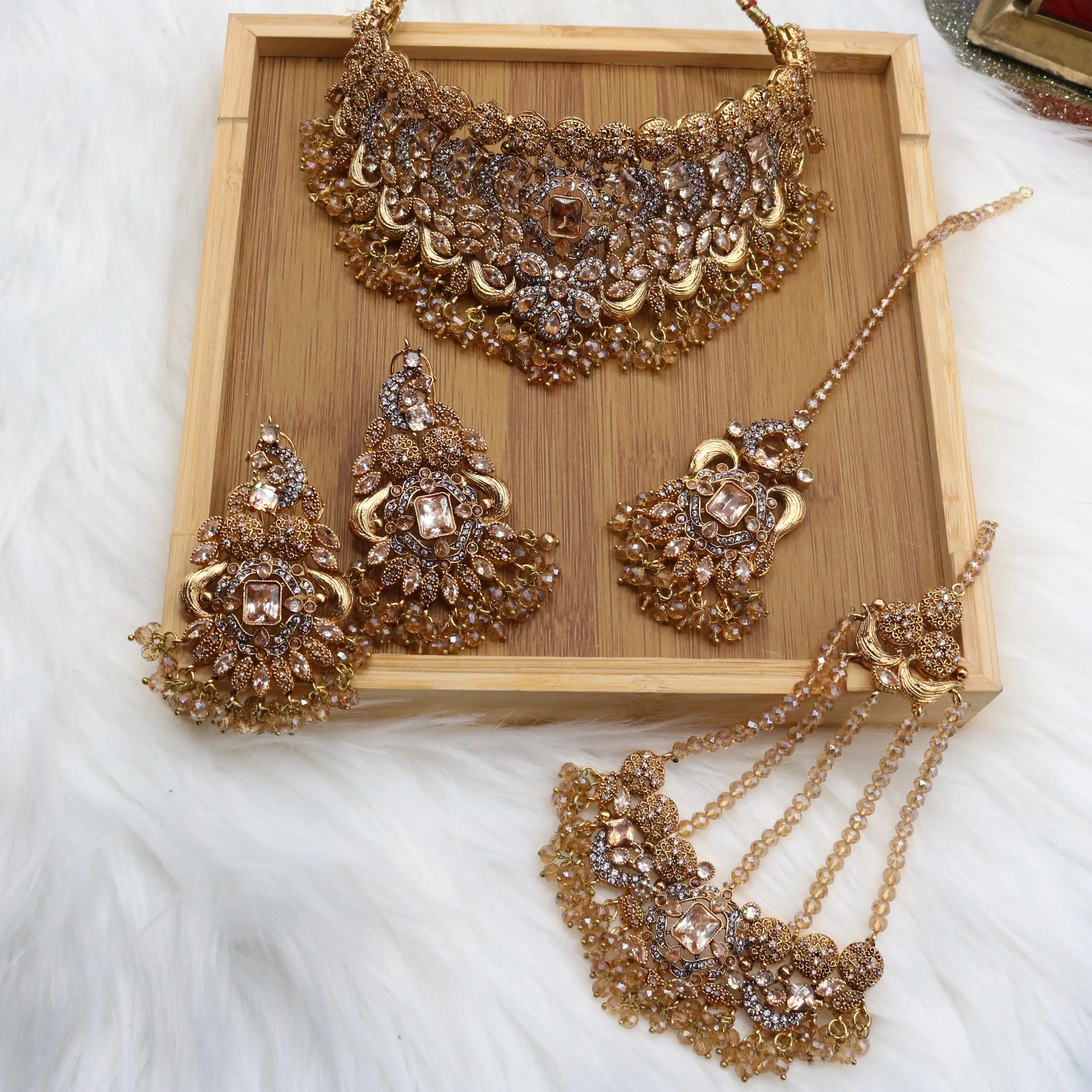 Champagne gold bridal choker jewelry set with earrings, teeka & jhoomer