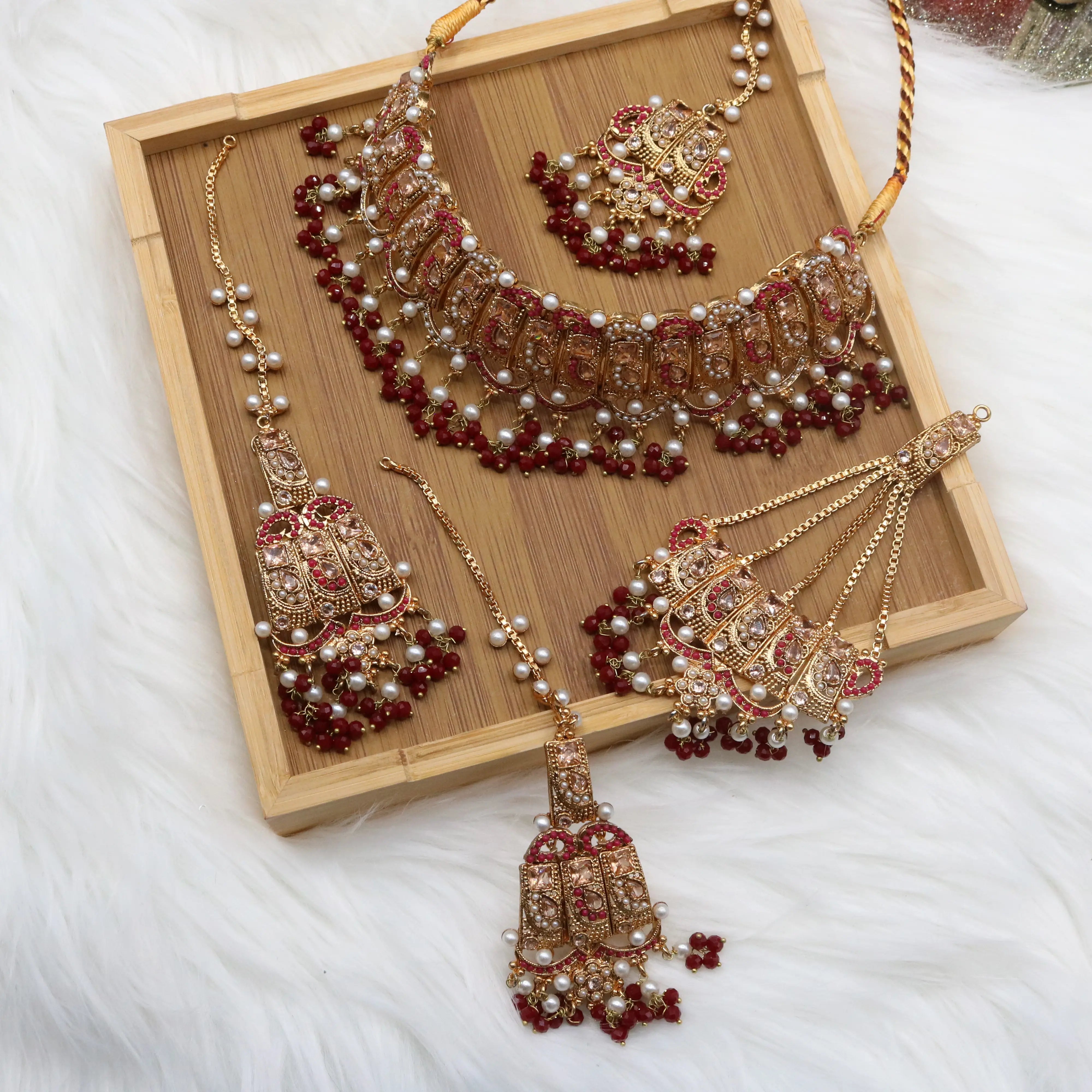 Gold bridal choker set with red stones, jhoomer & teeka