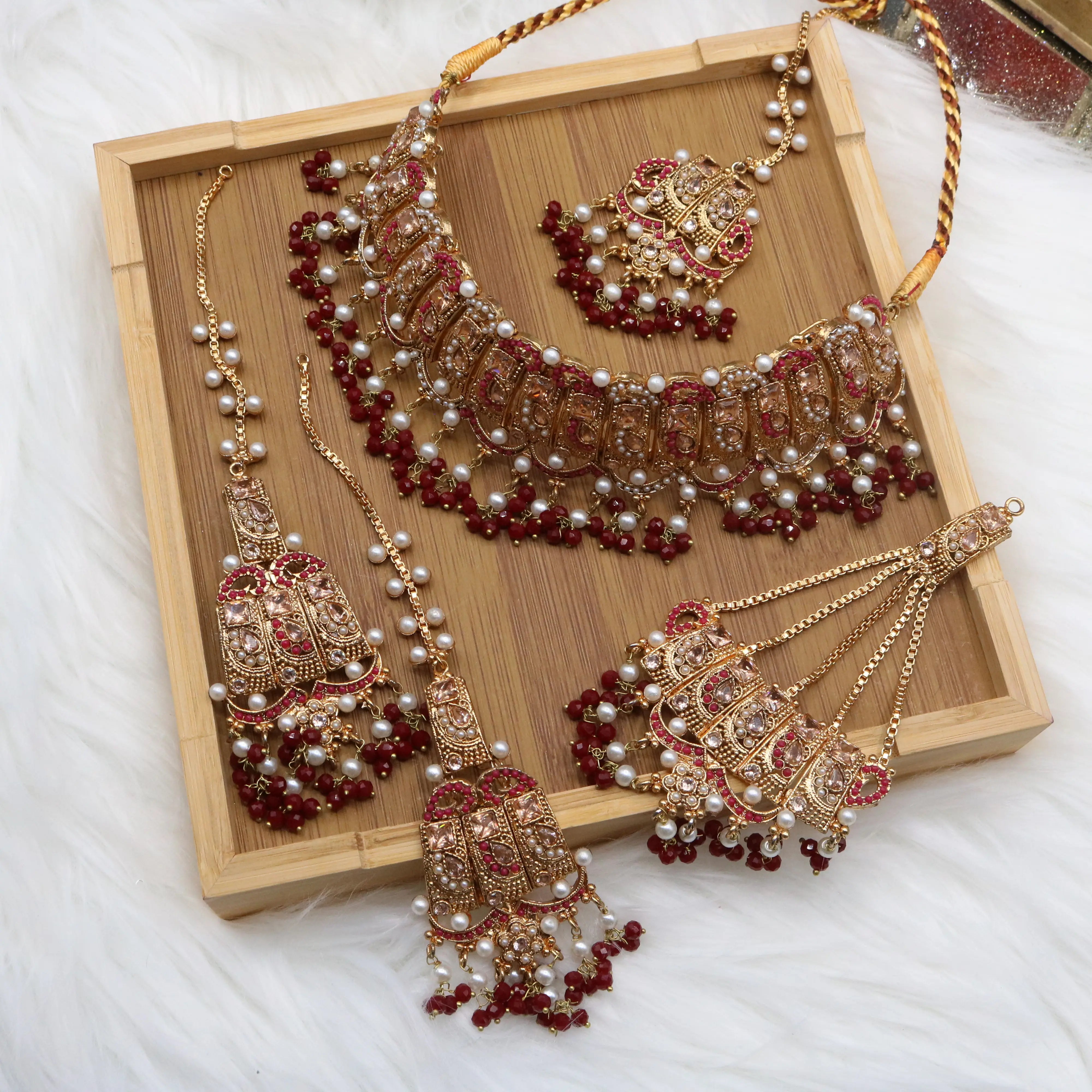 Pakistani wedding jewelry set with choker, earrings, and jhoomer
