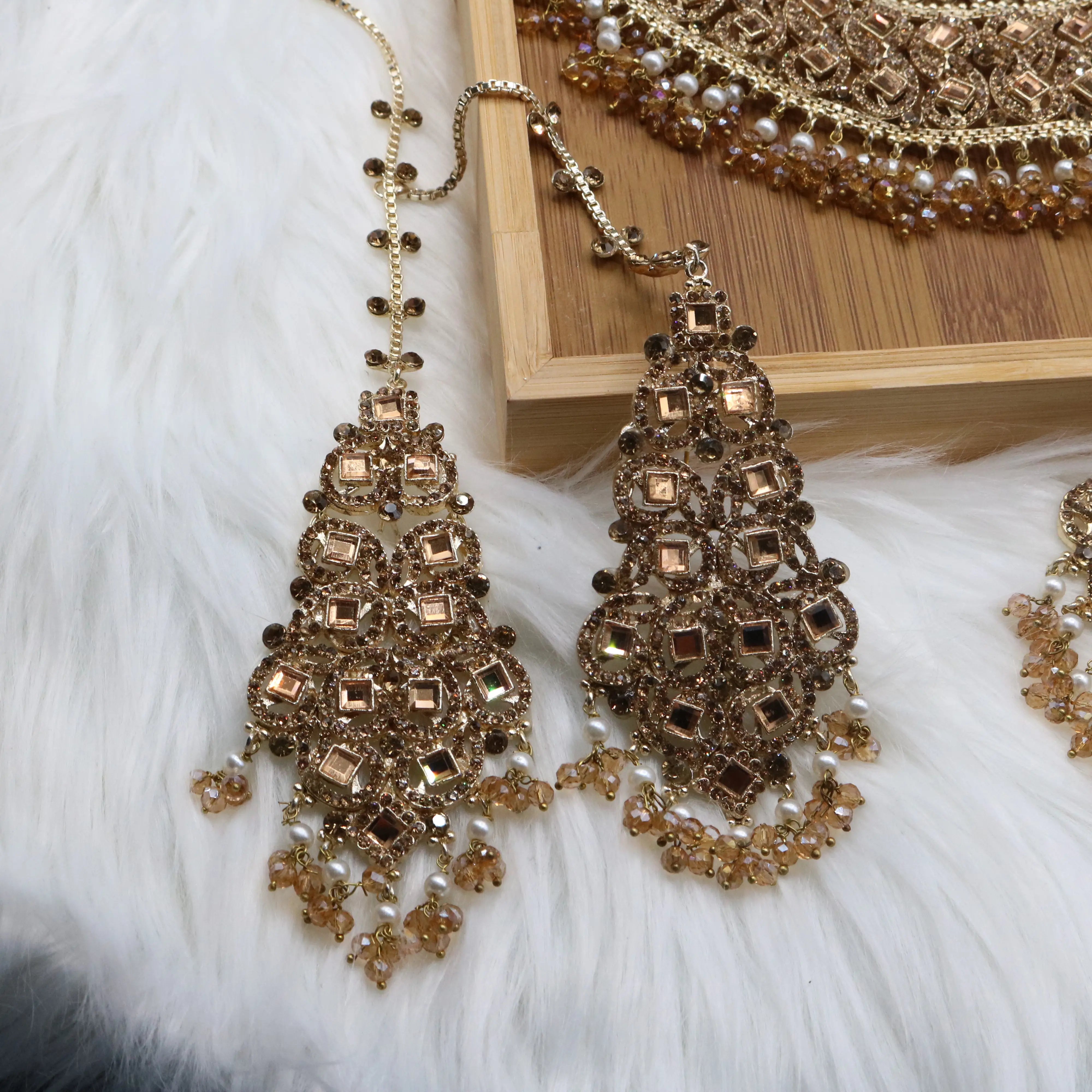 earrings view of Champagne gold Pakistani bridal necklace set with earrings, teeka & jhoomer