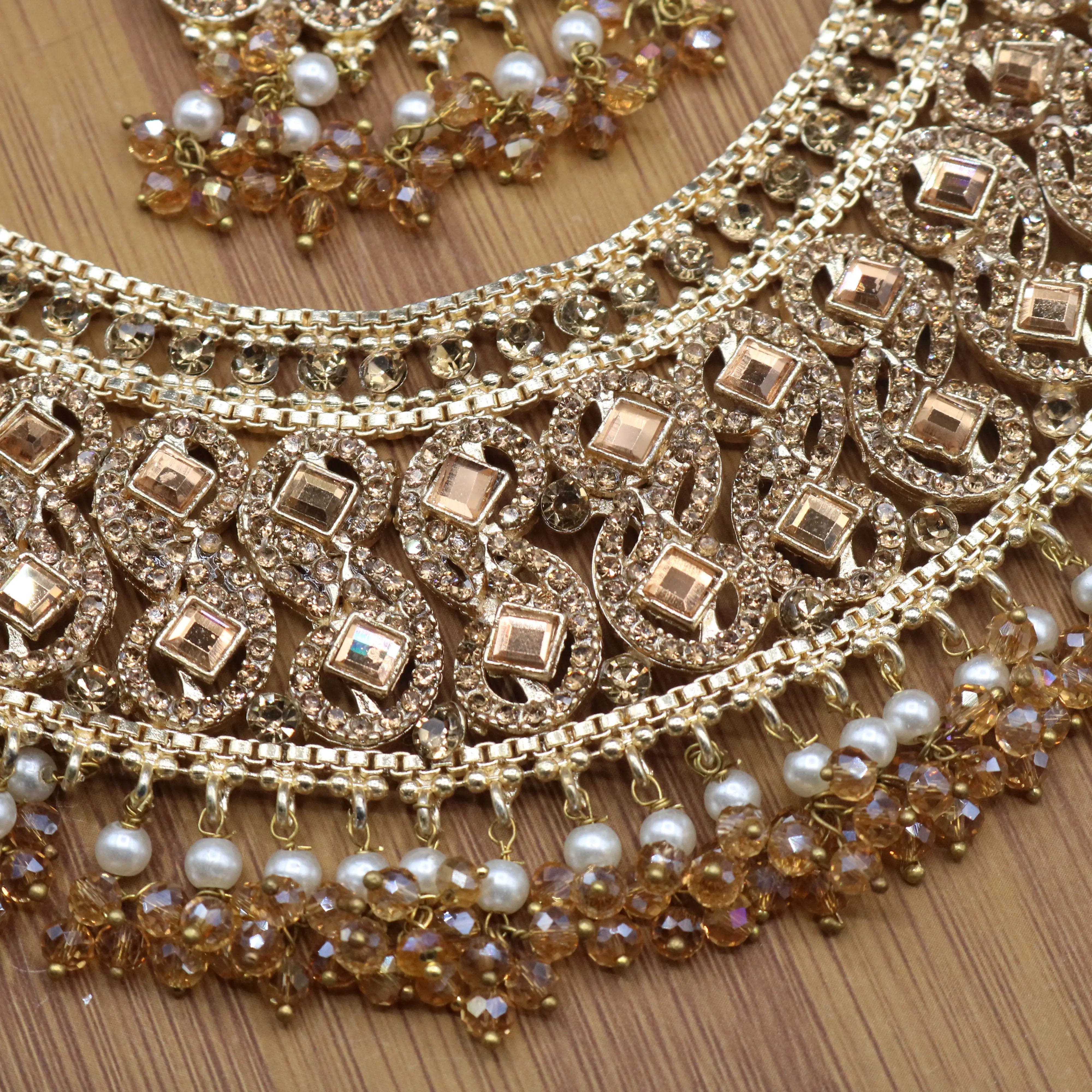 necklace closer view of Champagne gold Pakistani bridal necklace set with earrings, teeka & jhoomer