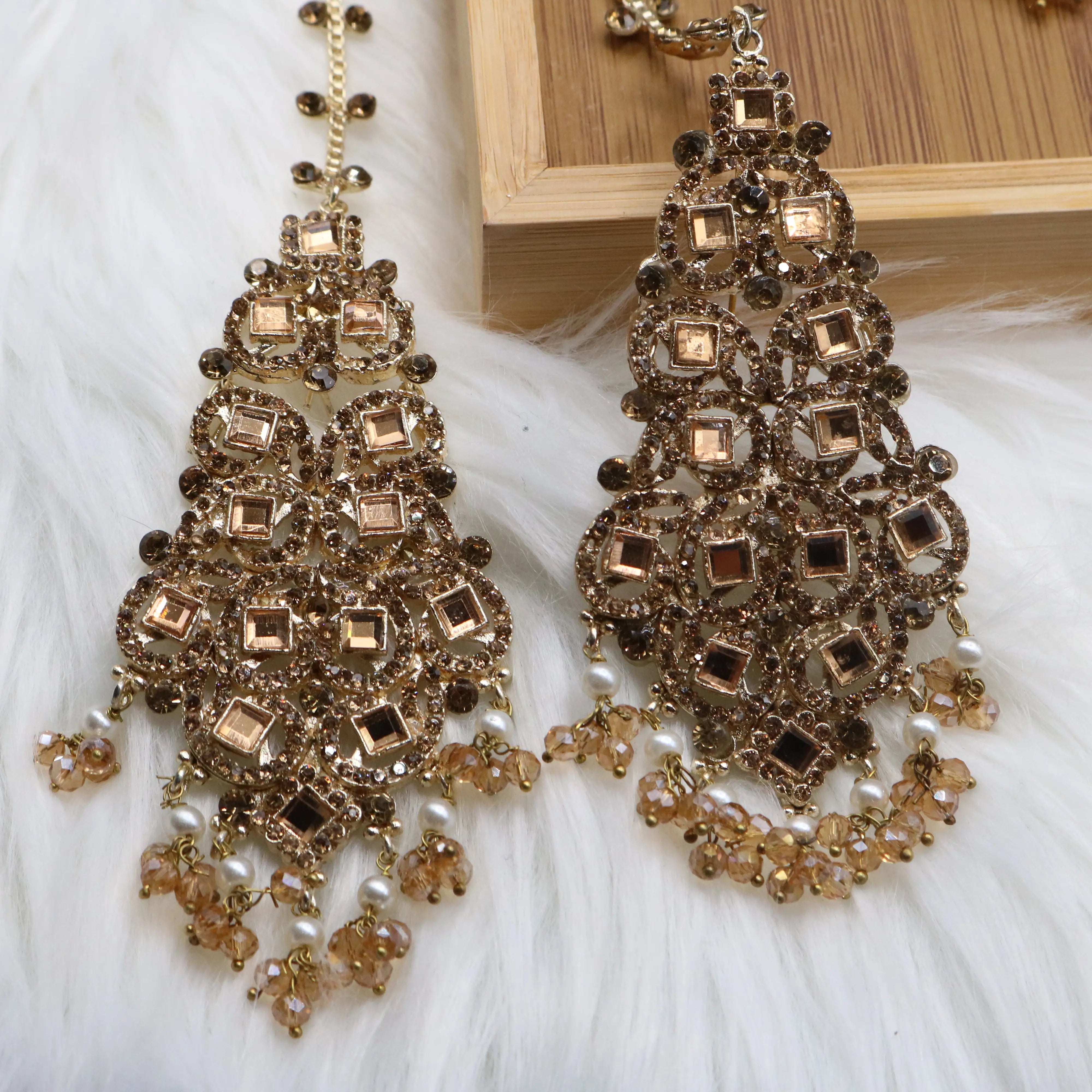 earrings closer view of Champagne gold Pakistani bridal necklace set with earrings, teeka & jhoomer
