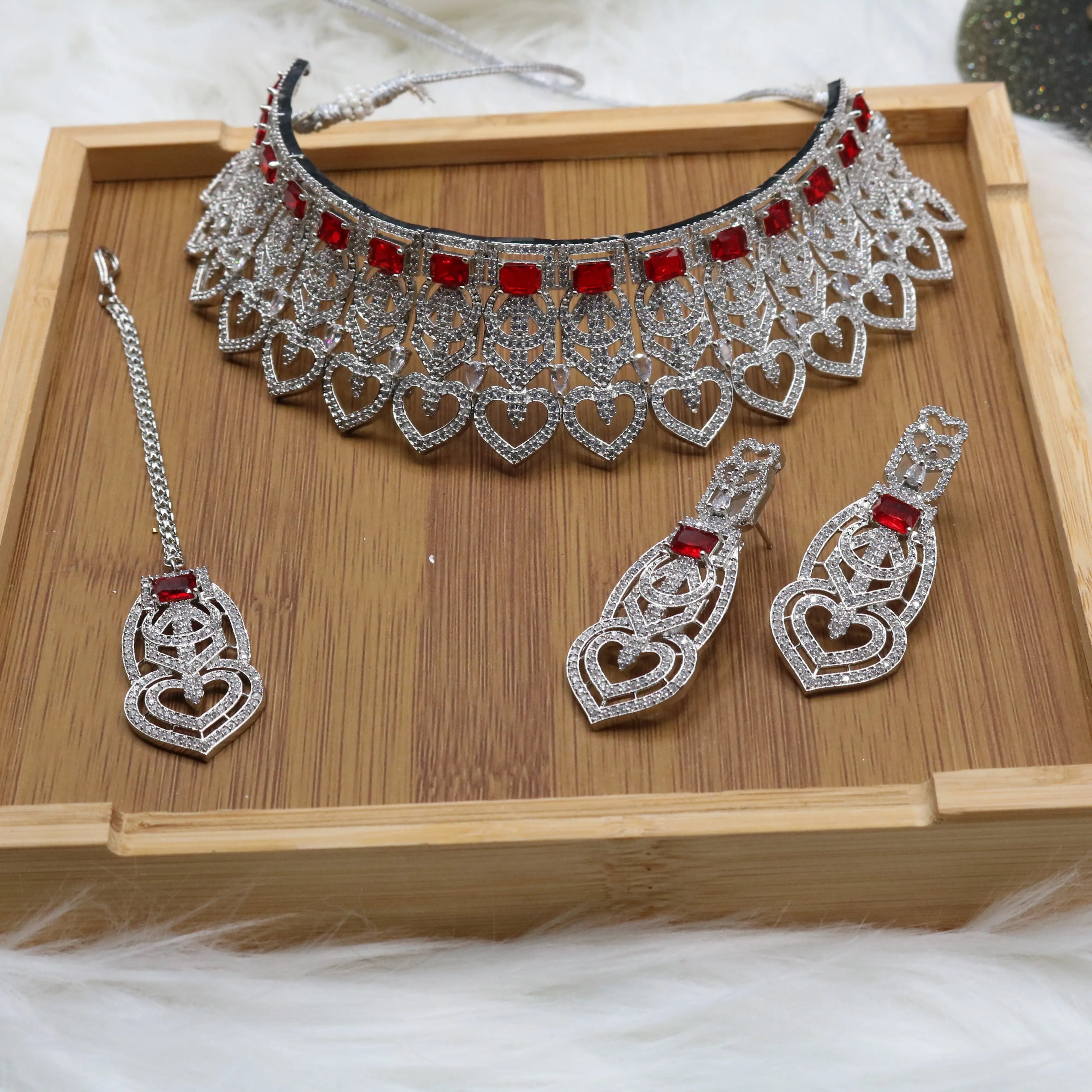 Silver and red Pakistani bridal choker set with earrings and teeka