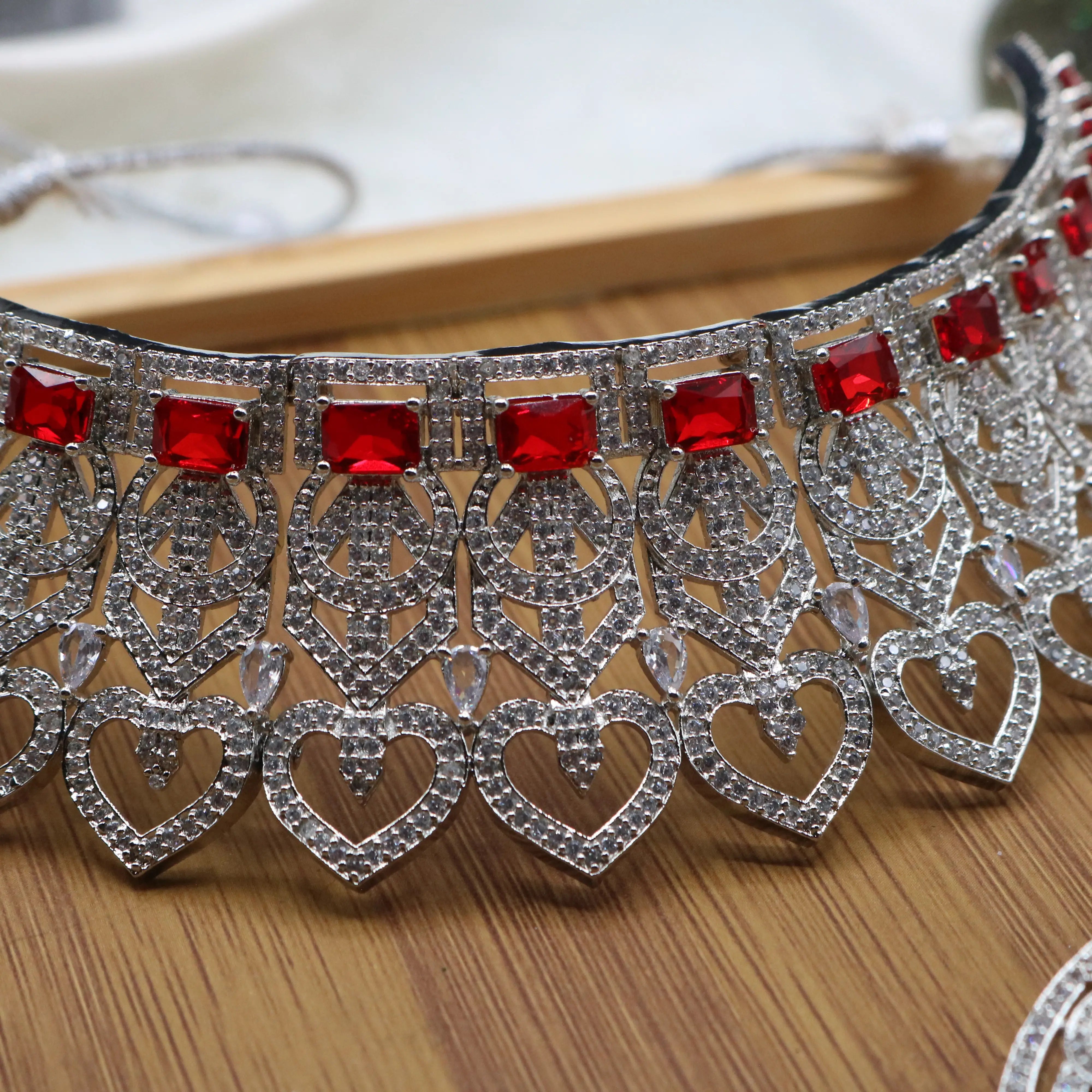 necklace view of Silver and red Pakistani bridal choker set with earrings and teeka