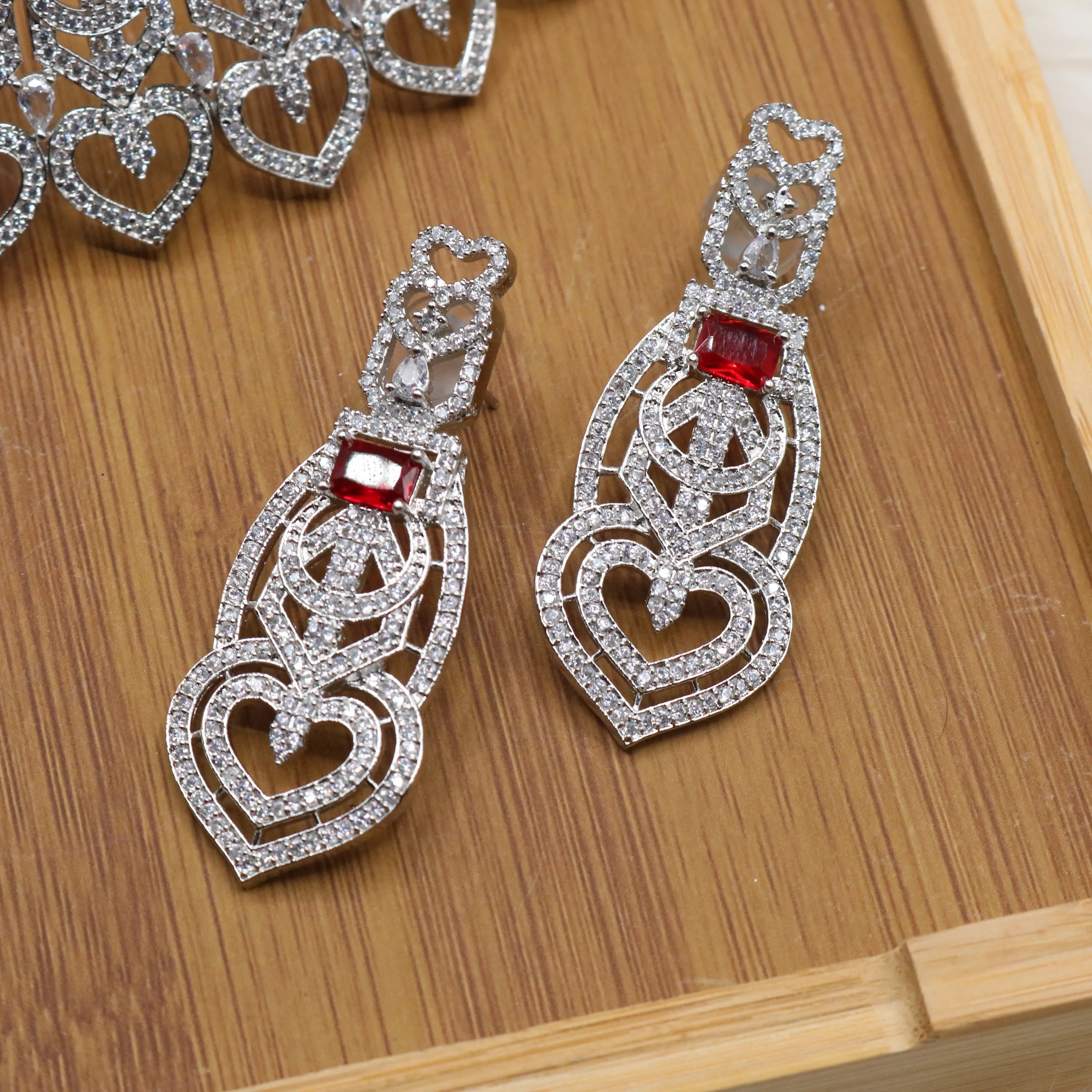 earrings view of Silver and red Pakistani bridal choker set with earrings and teeka