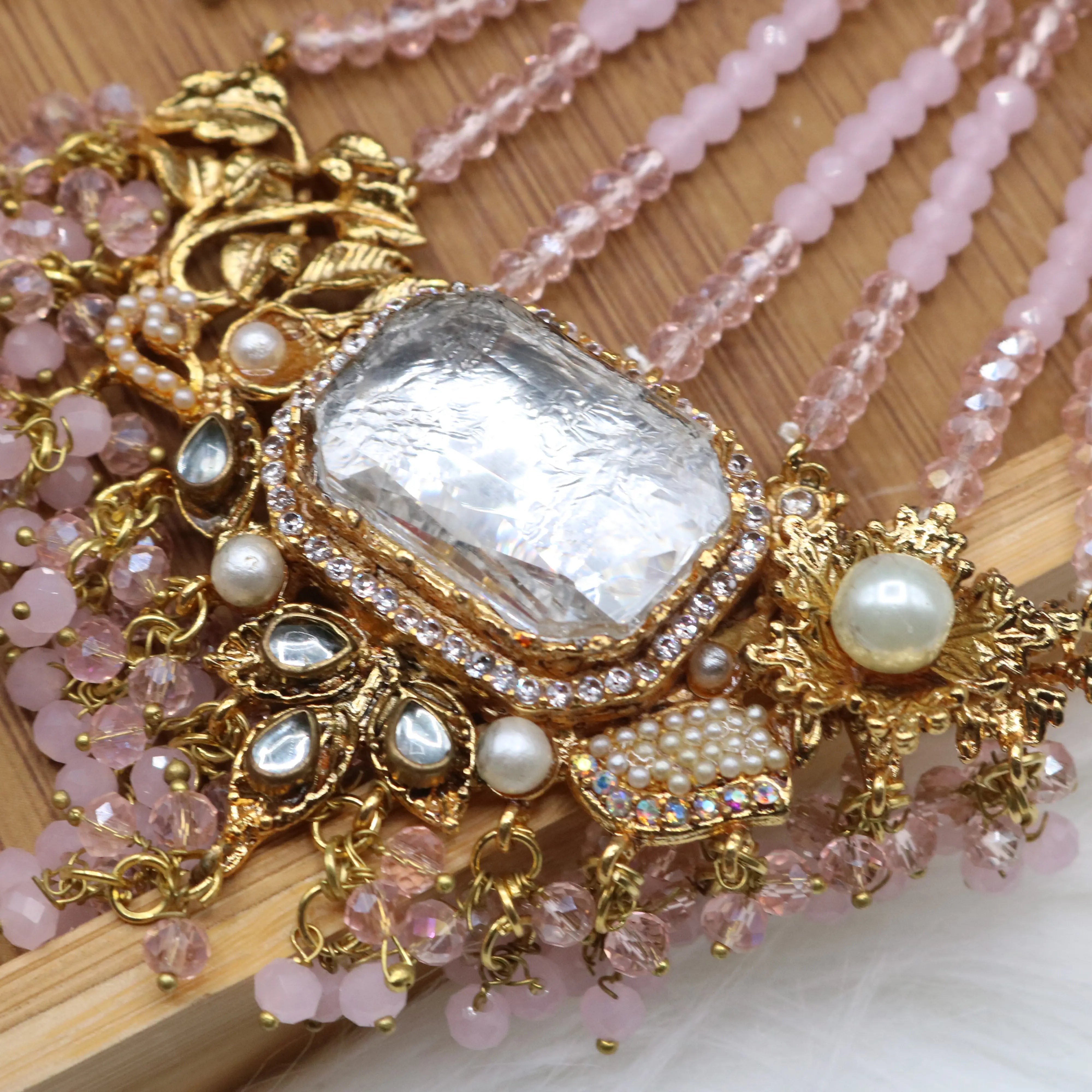 closer jhoomer view of Pastel pink and gold Pakistani bridal choker jewelry set with jhoomer