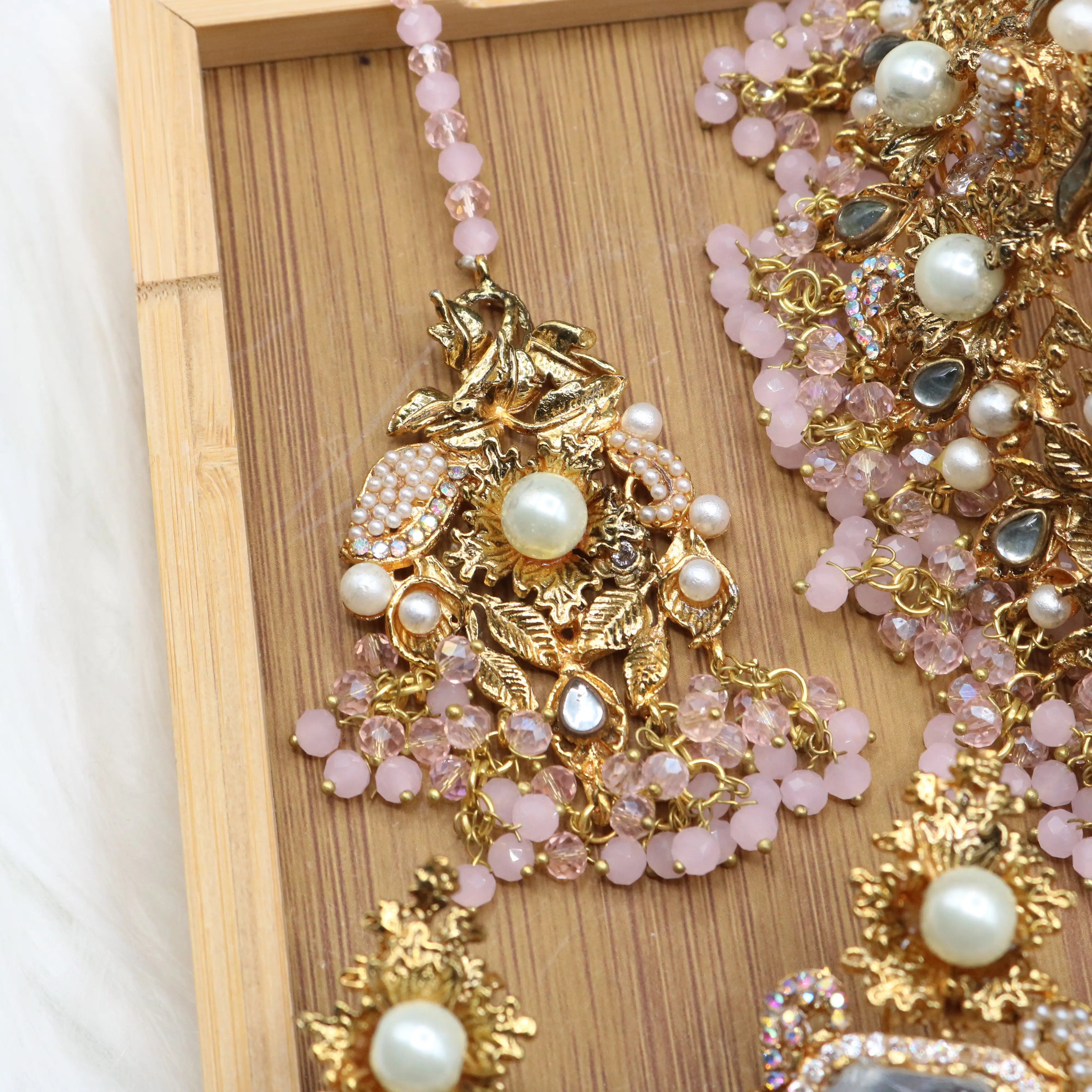 teeka view of Pastel pink and gold Pakistani bridal choker jewelry set with jhoomer 