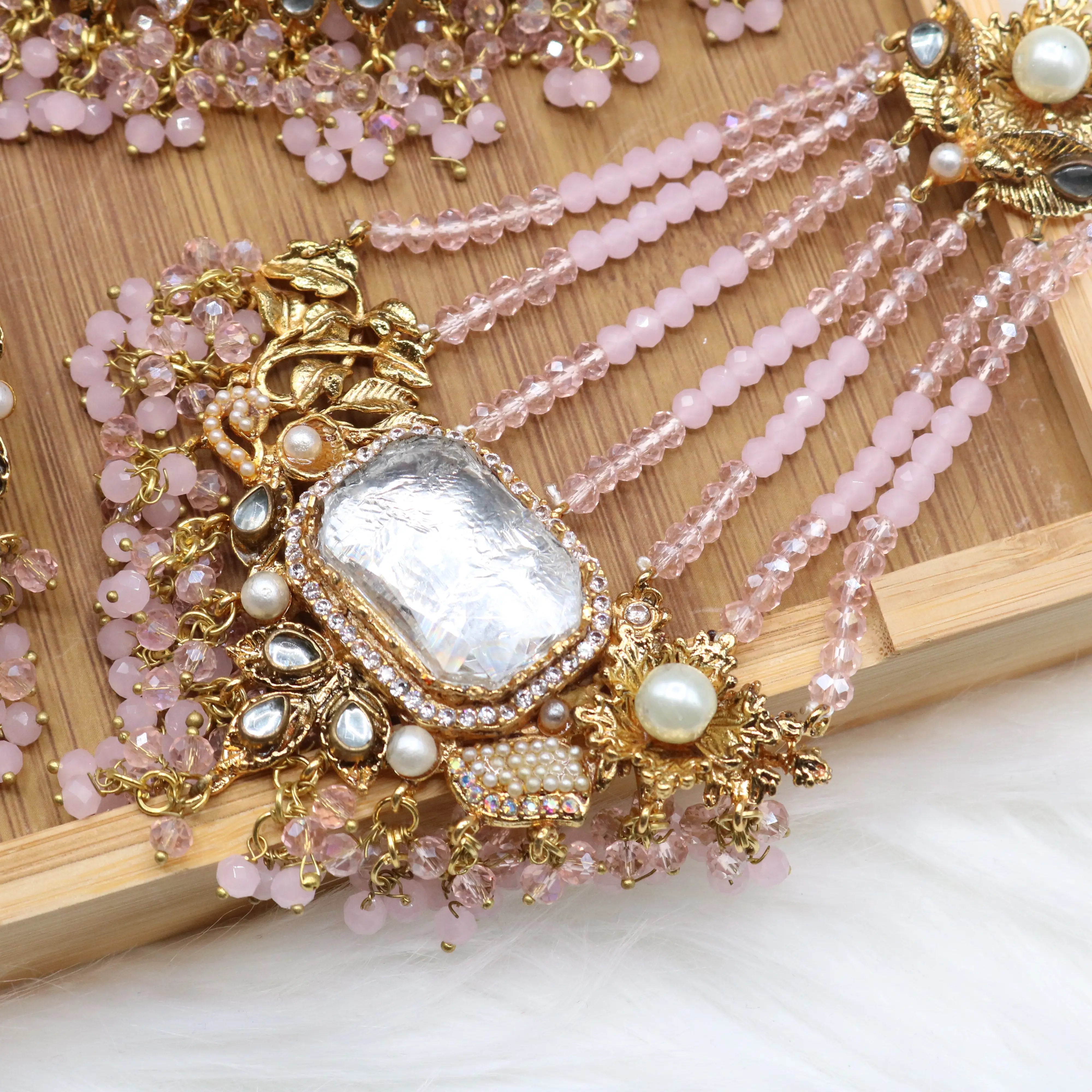 jhoomer view of Pastel pink and gold Pakistani bridal choker jewelry set with jhoomer
