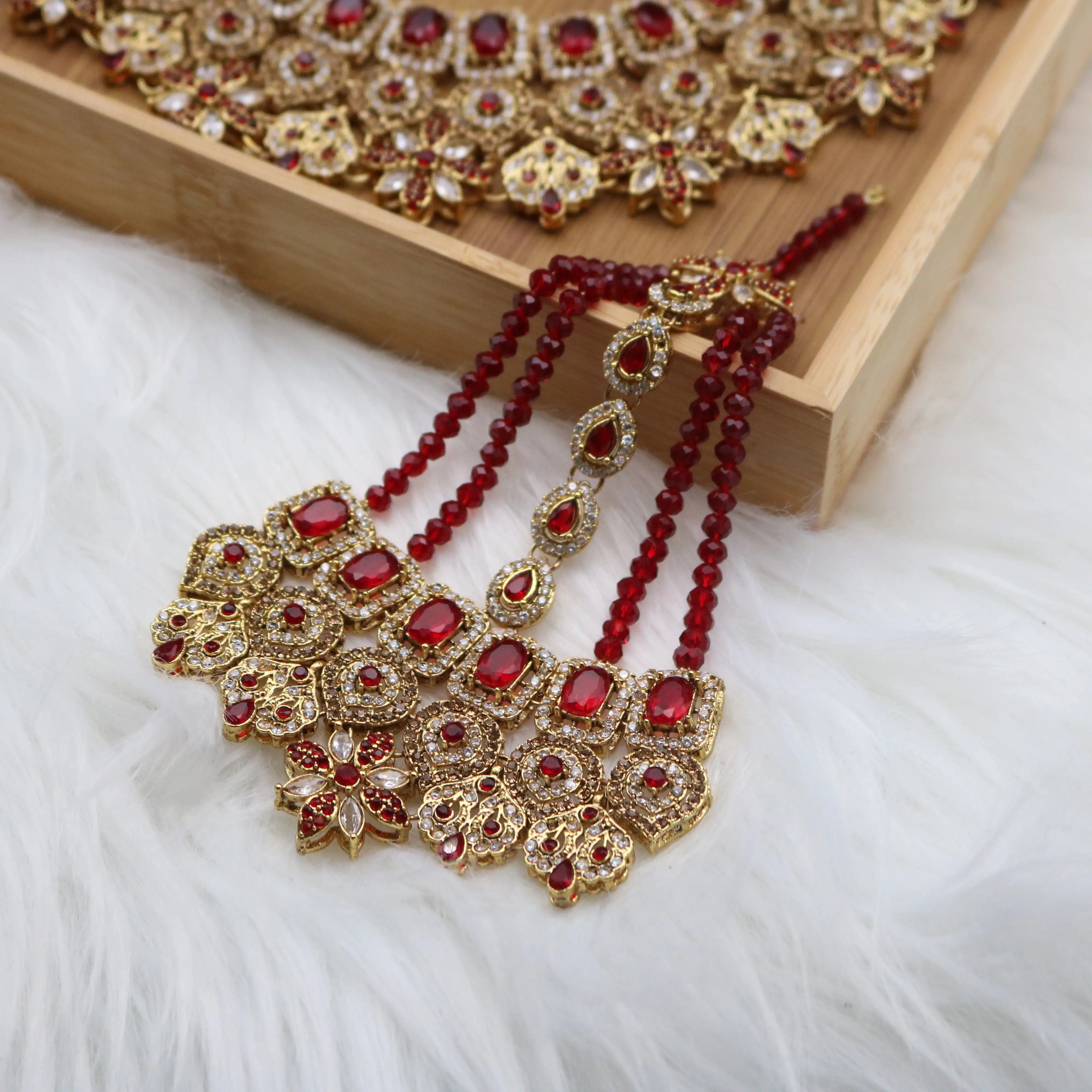 jhoomer view of Red Pakistani bridal necklace set with earrings, teeka & jhoomer