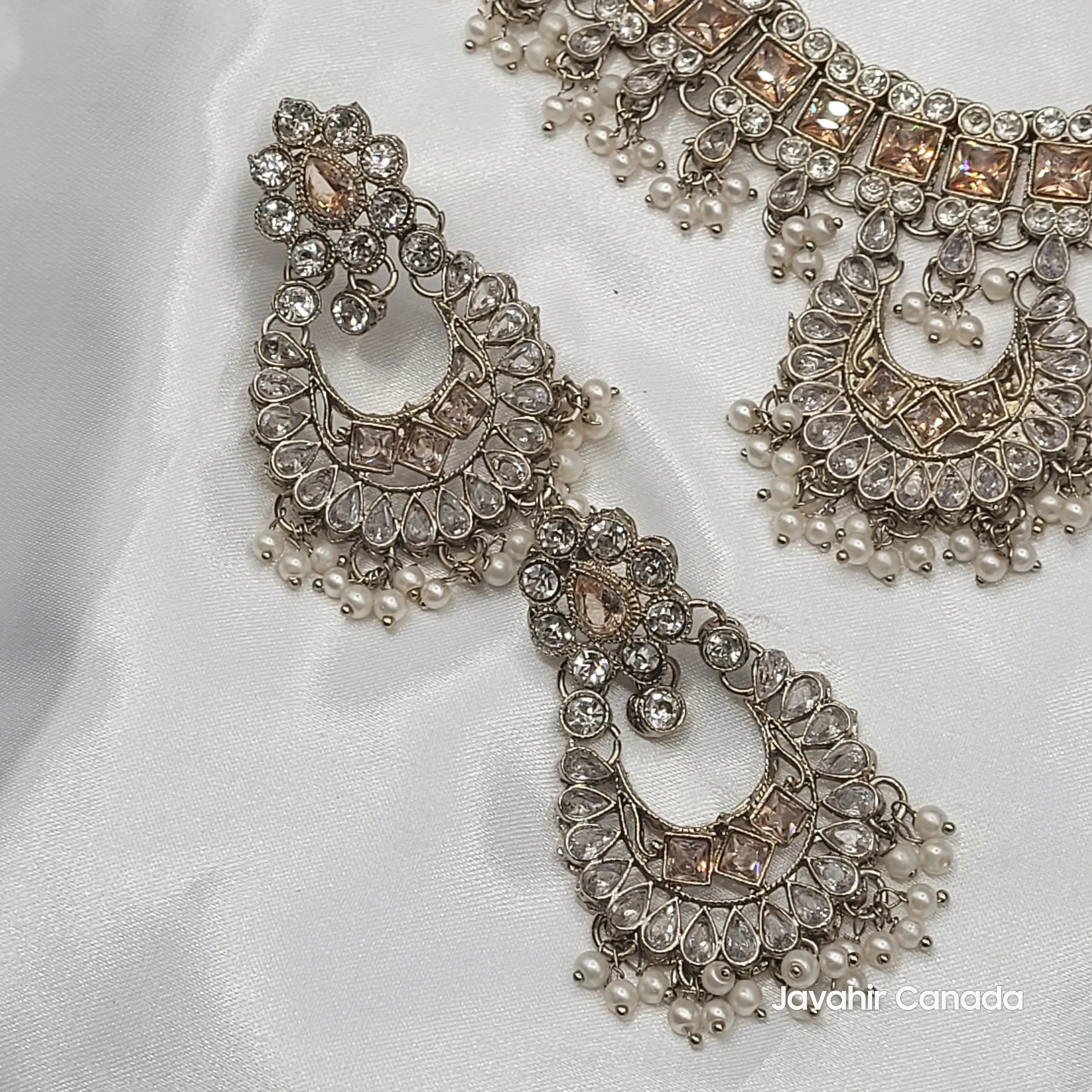 Earrings from JV156 set with crescent kundan design and hanging pearls.