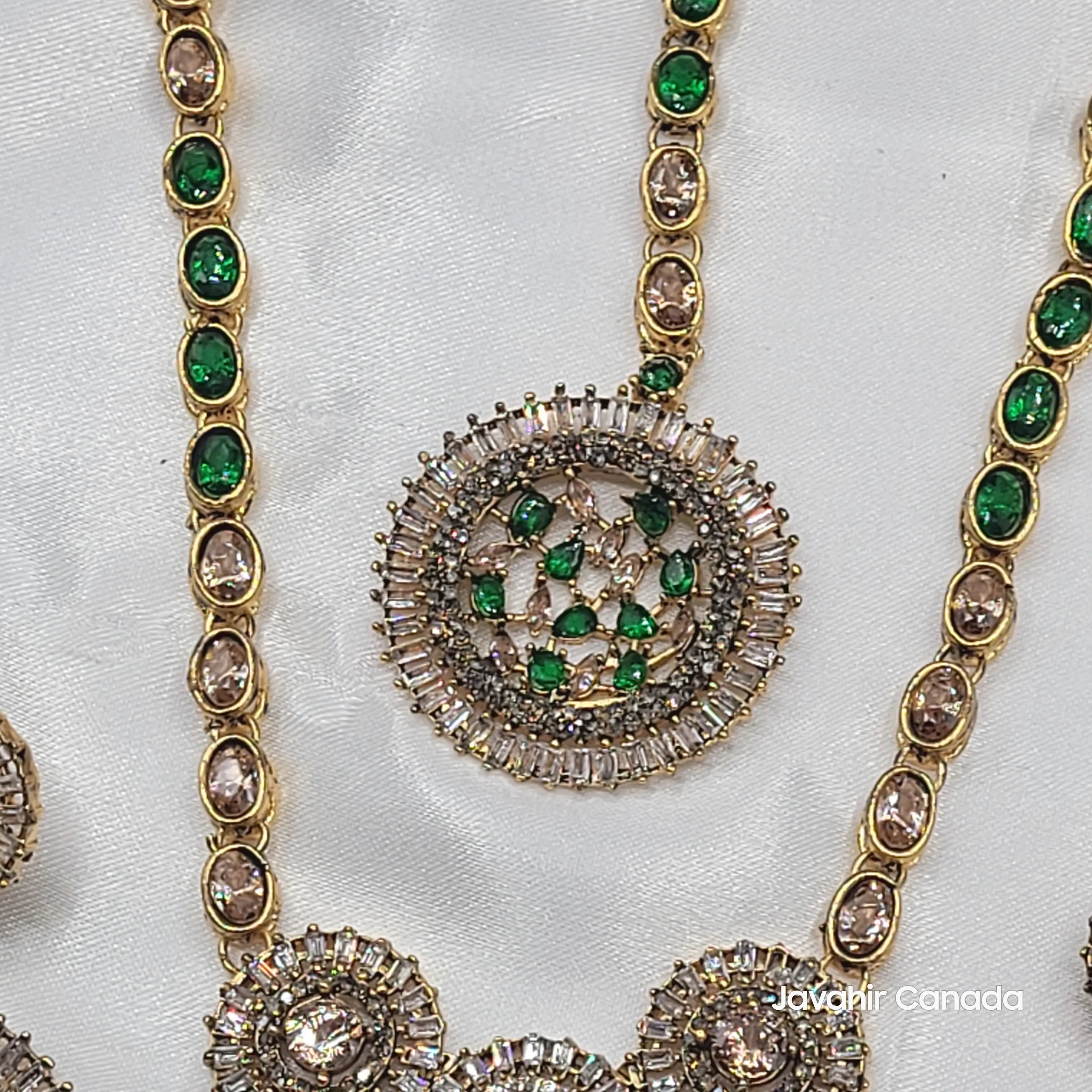 Top close-up of green teeka with CZ baguette framing and colored stones