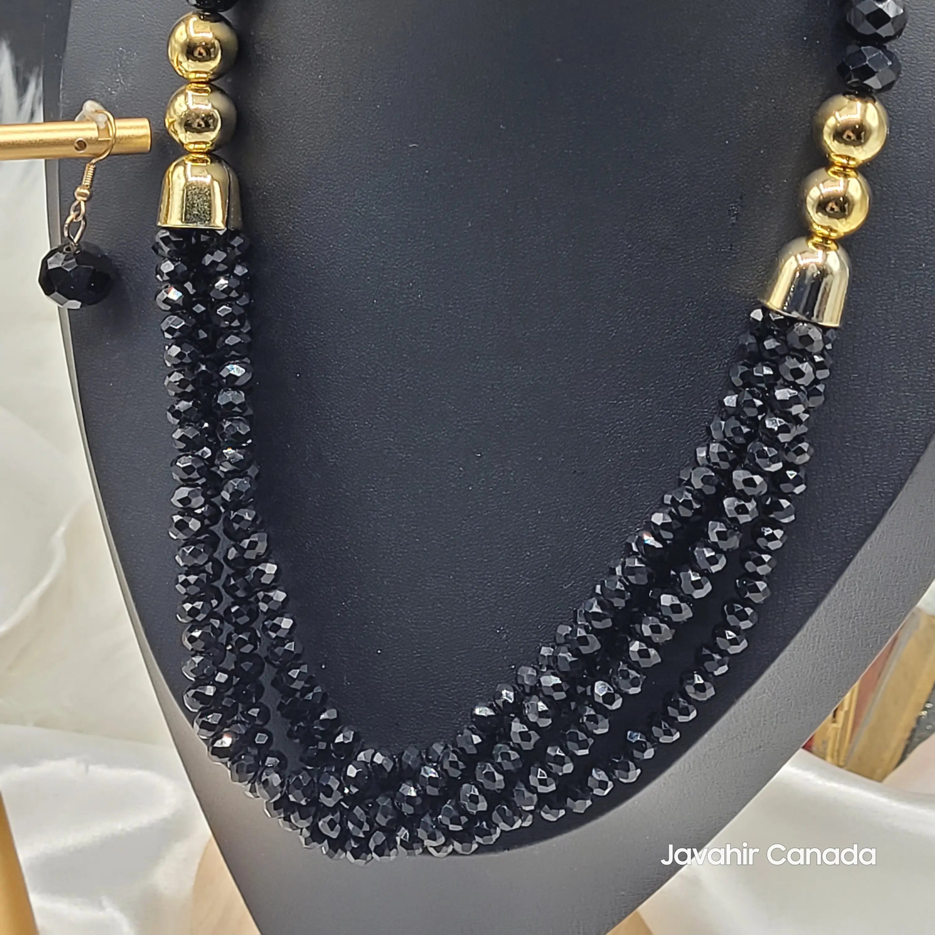 Close-up of the black crystal bead necklace in the JV161 set, showing detailed shimmer and bold color. Matching earring shown beside the set.