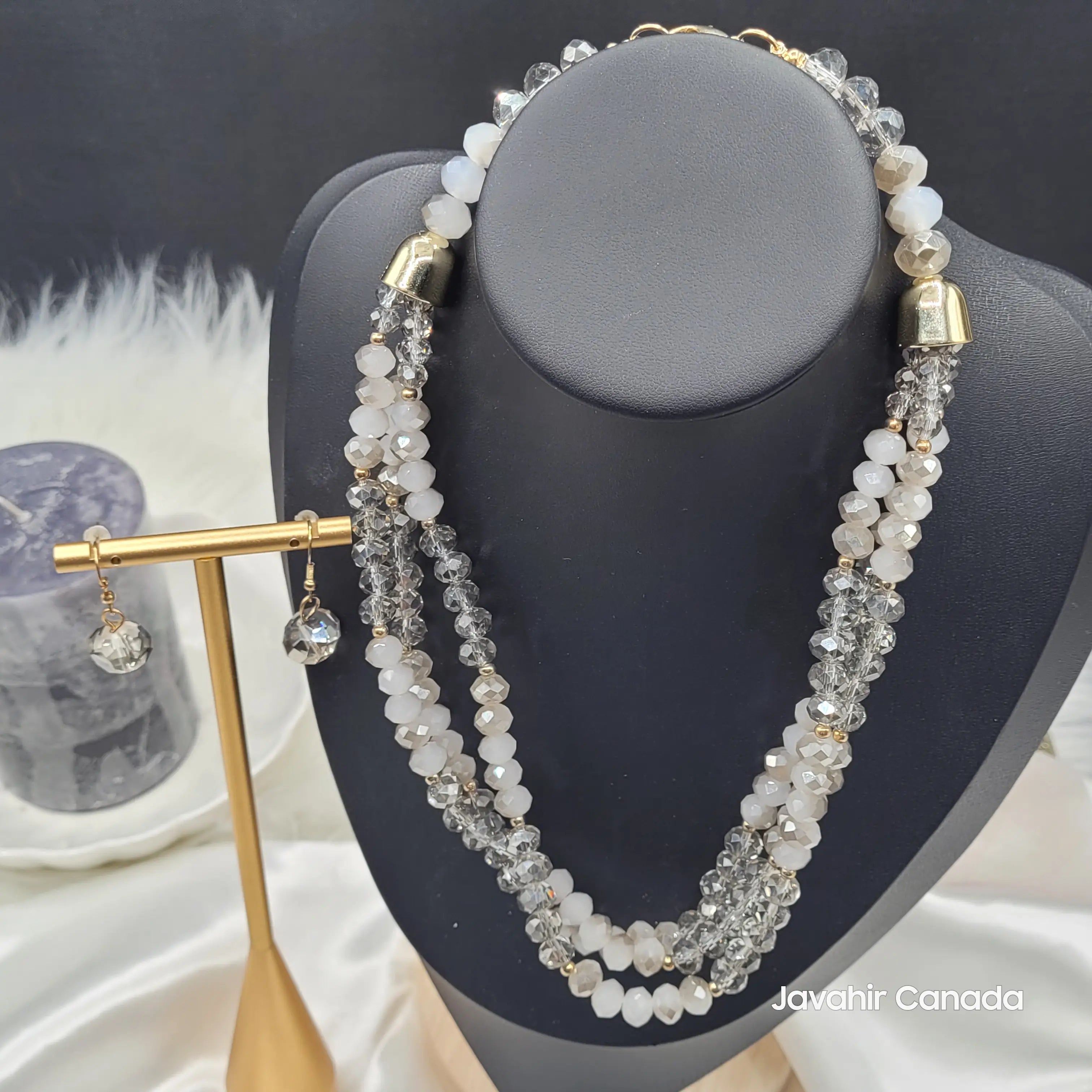 Full front view of the smoky grey and white JV161 necklace set, showcasing a soft shimmer and classic color pairing. Matching crystal earrings are displayed on the side.