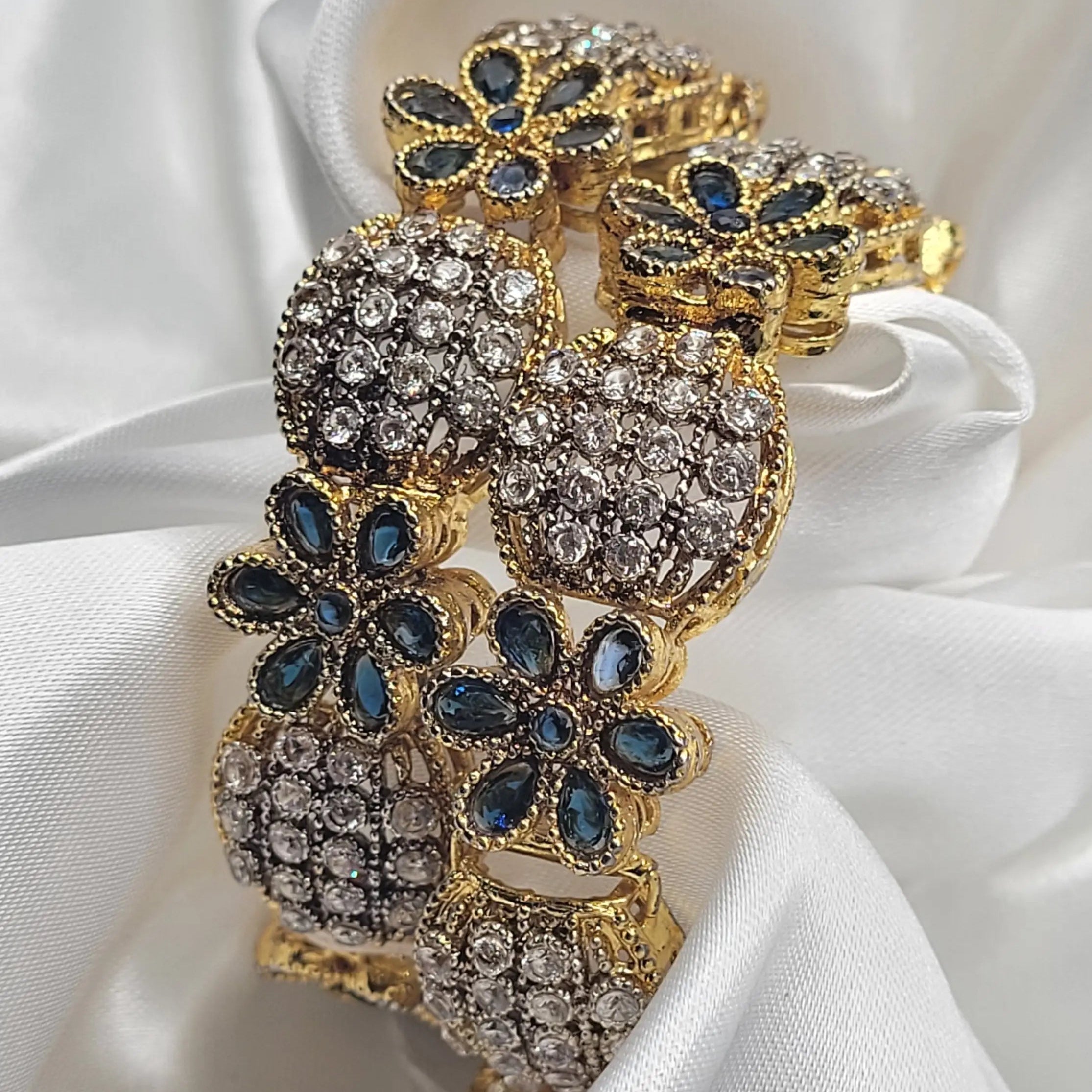 Blue stone-studded openable bangles variant on a white satin background – JV3001