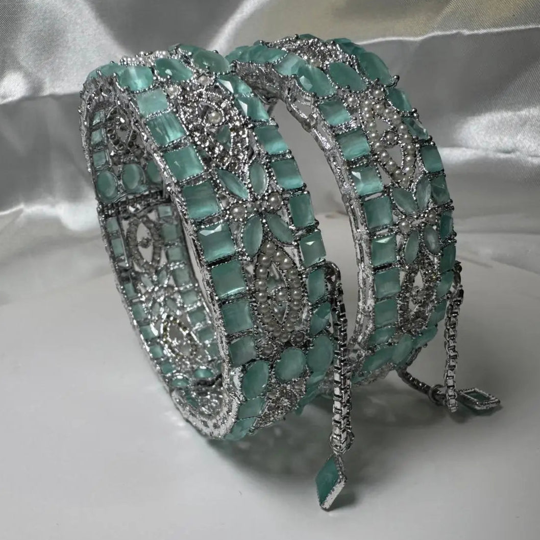 Turquoise and silver bracelet on a reflective surface