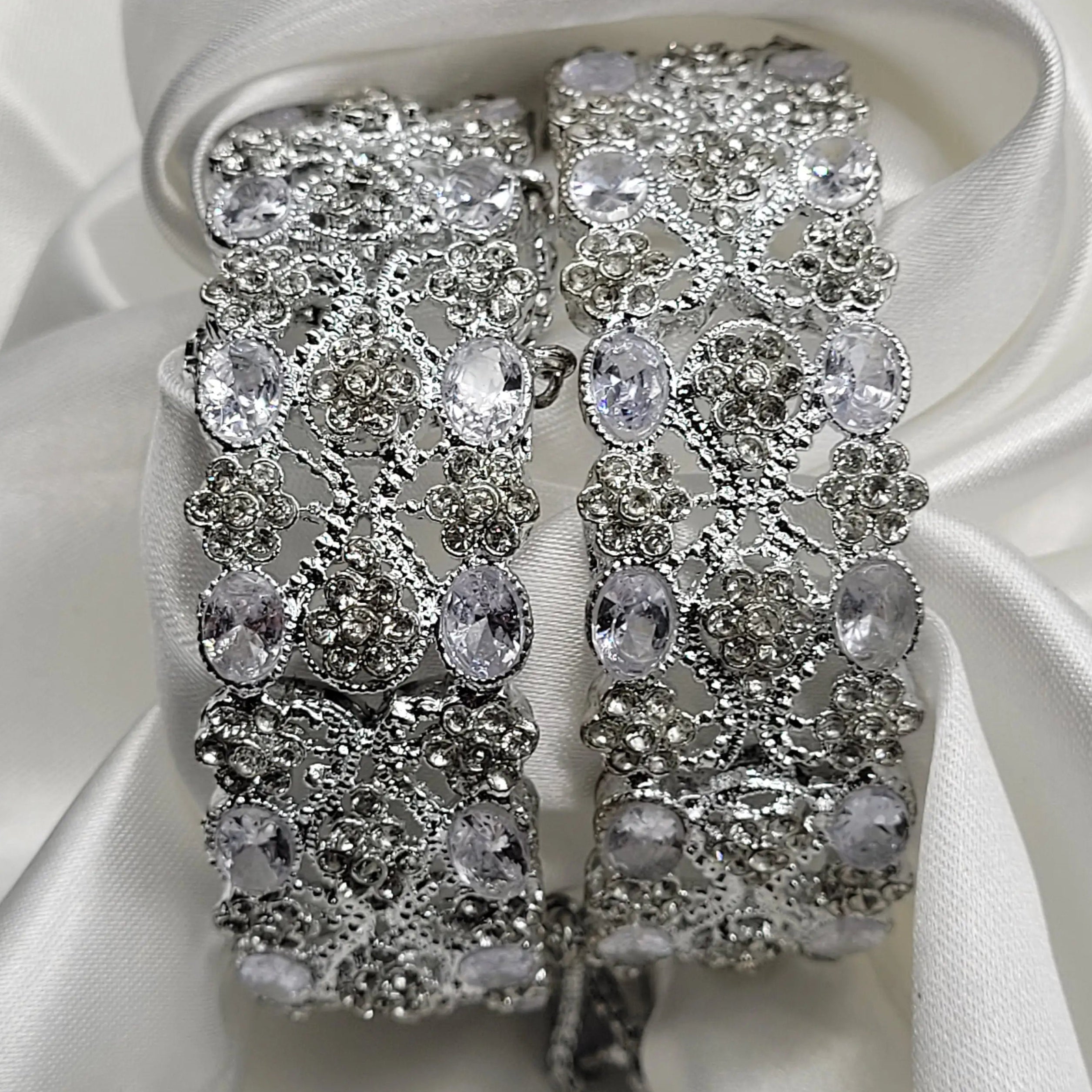 JV3005 clear CZ crystal bangles with silver floral accents – top view