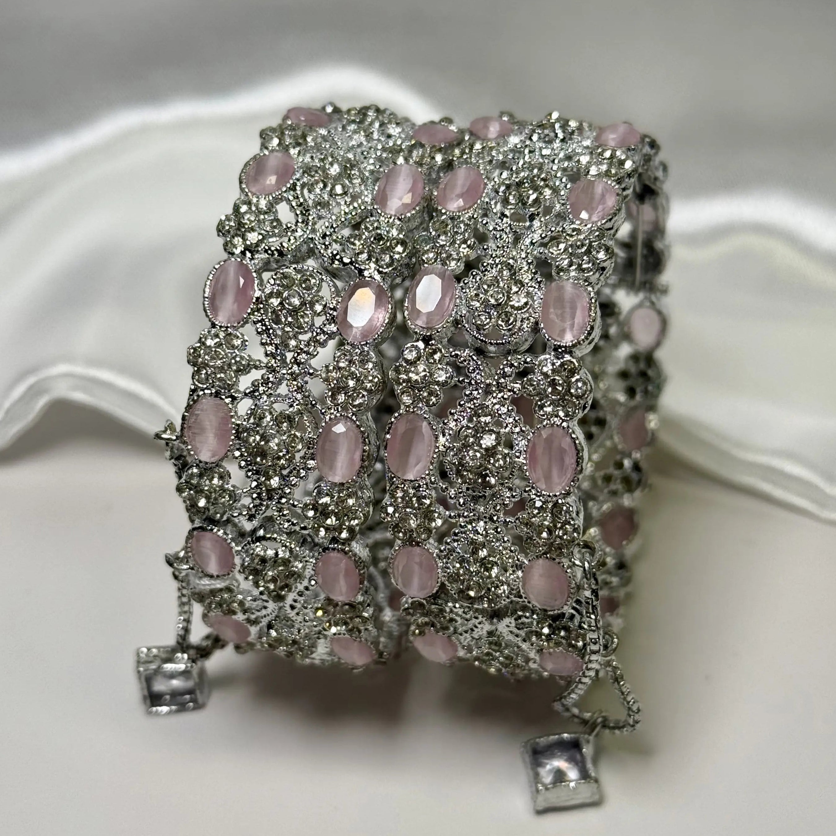 Elegant party bangles with floral design and pink crystals