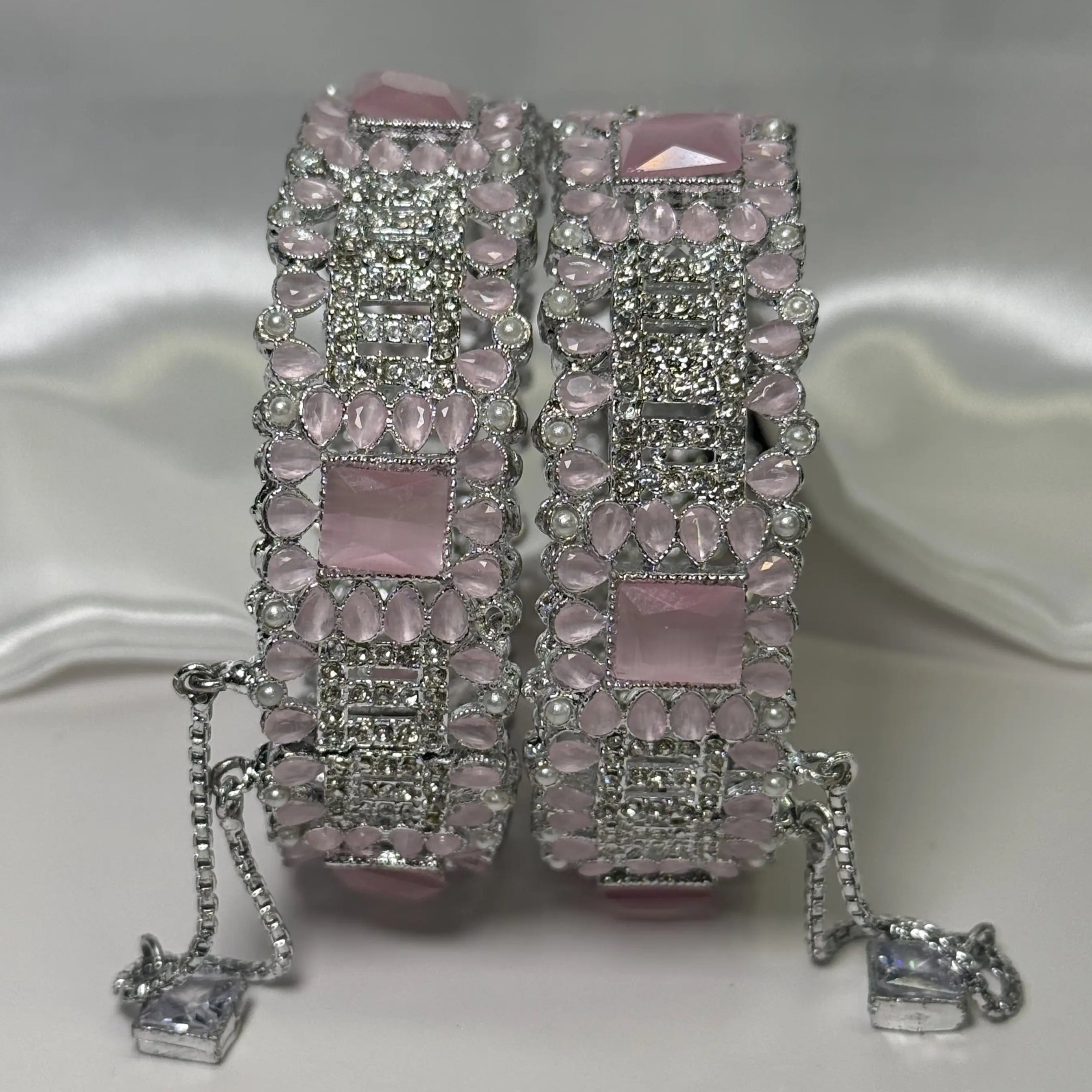 Openable silver bangles with large pink stones and cubic zirconia