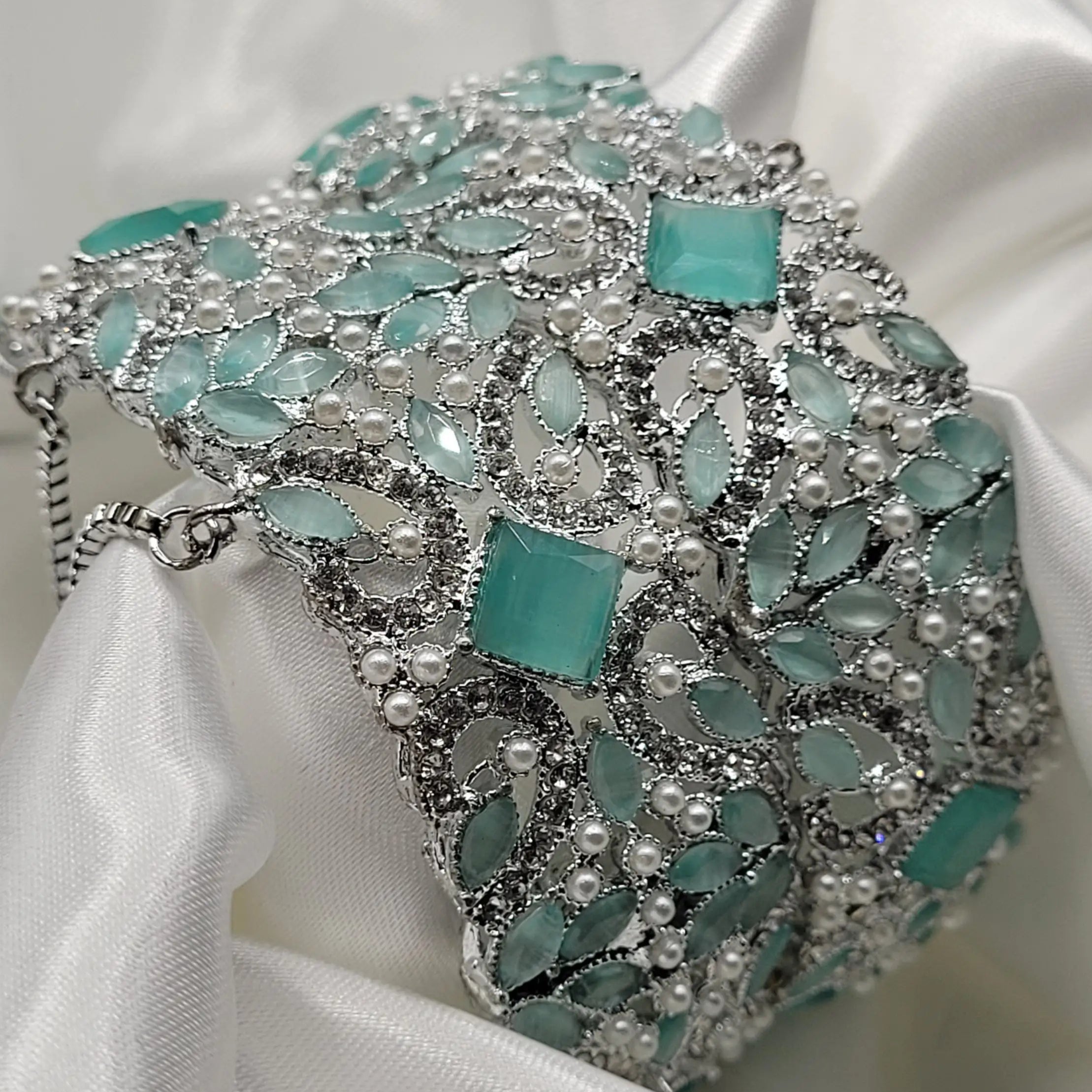 Cool-tone CZ bangles with floral pattern and safety chain