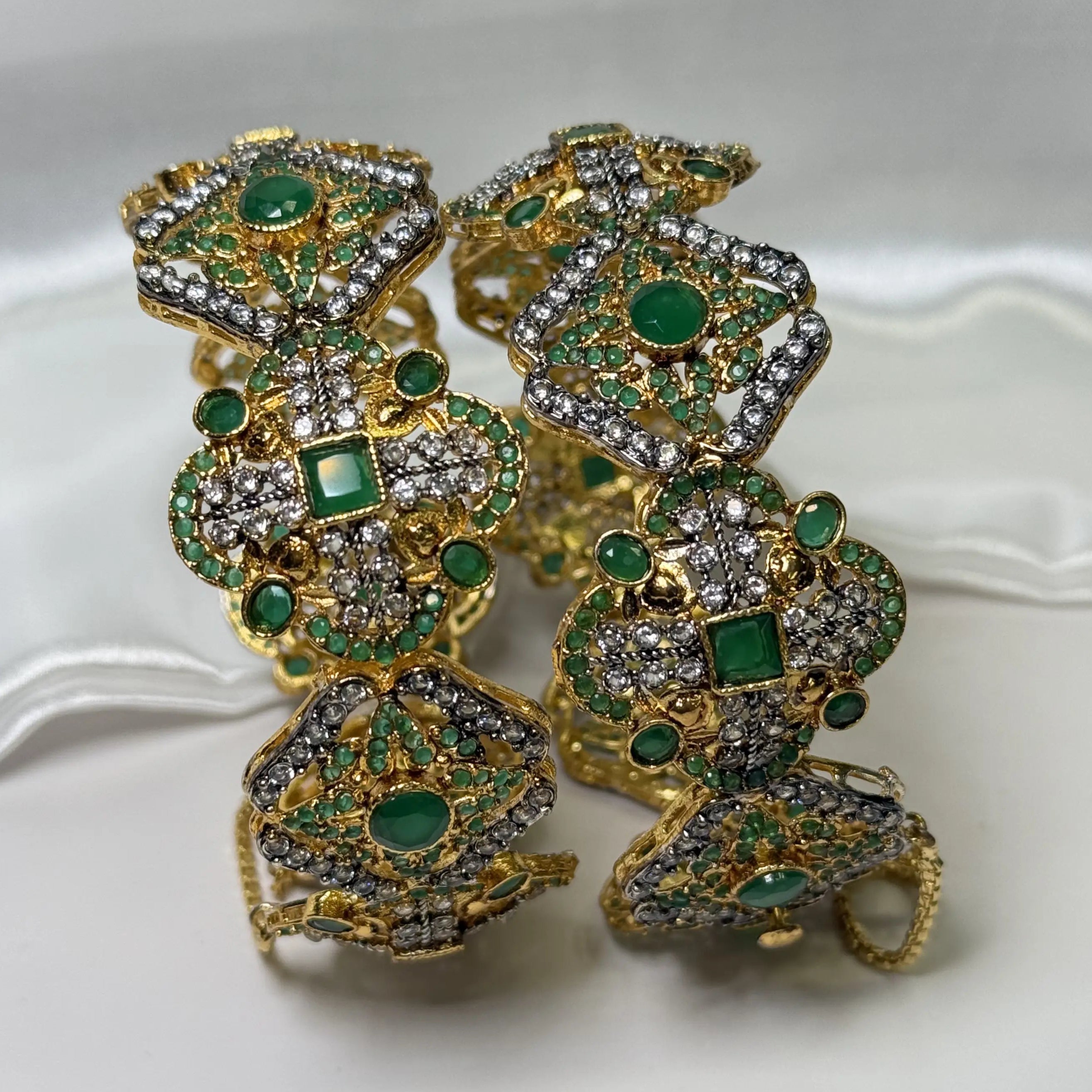 Side view of JV3008 bridal bangles with green stones in symmetrical design