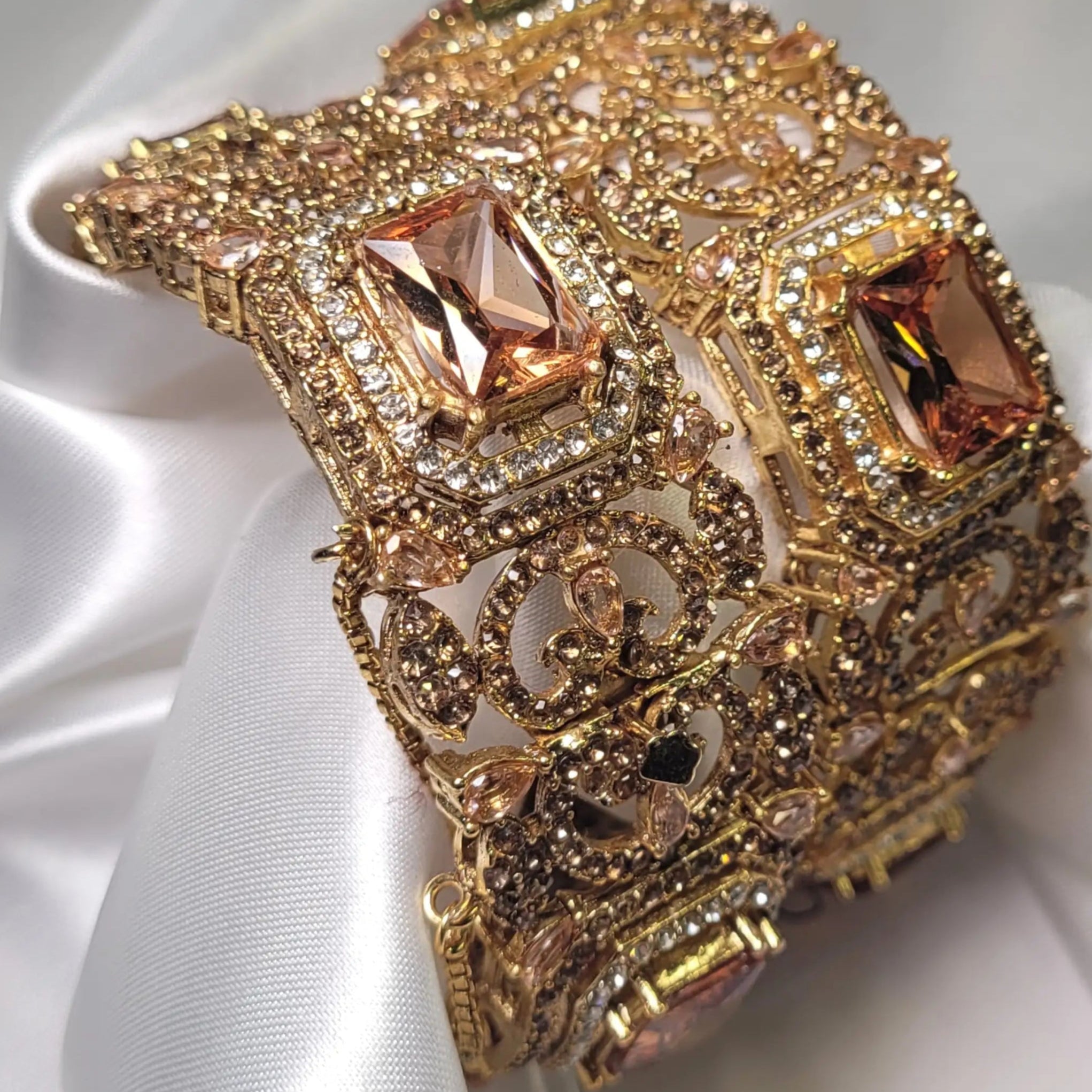 Champagne color wide antique bangle with peach-toned stone - side view