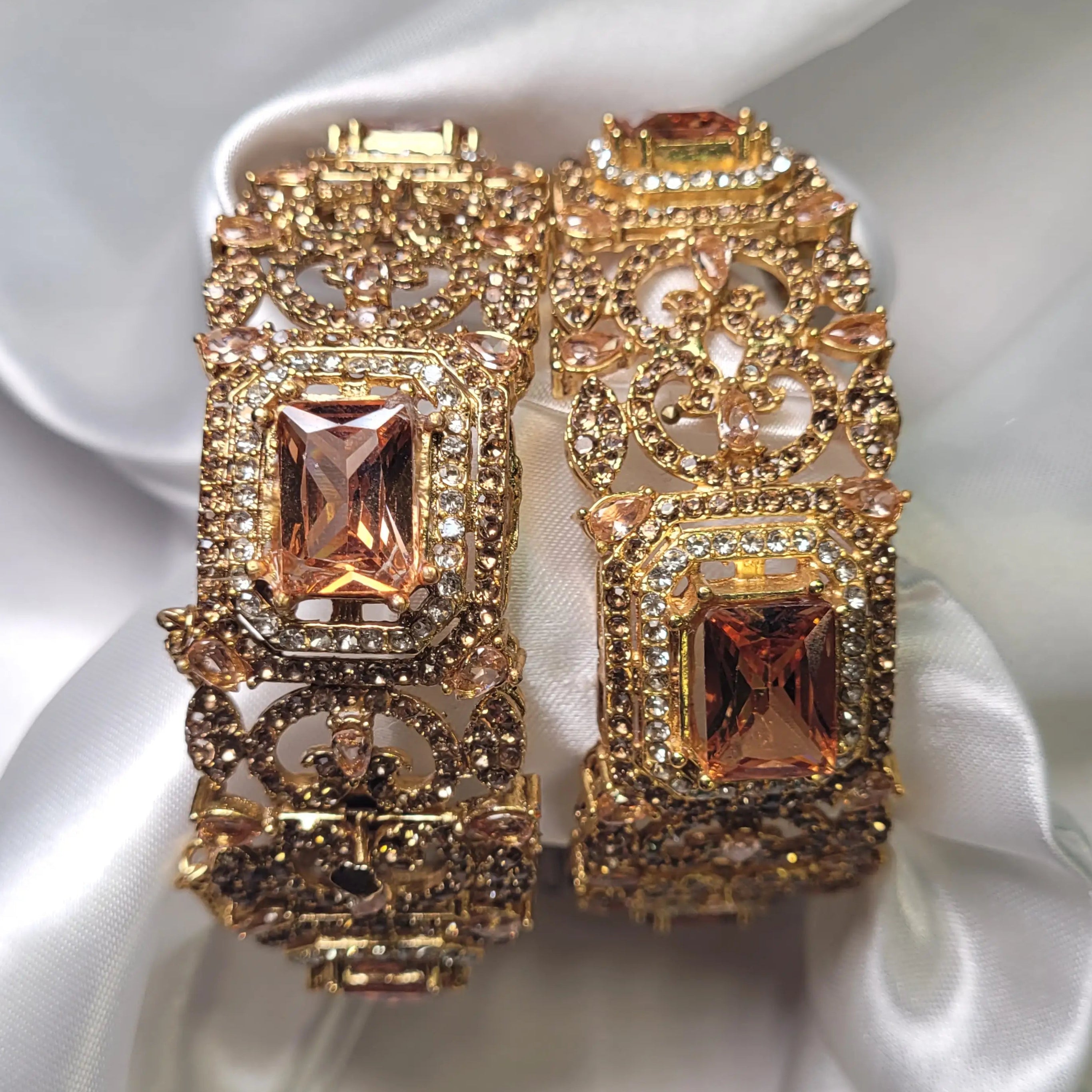 Champagne color wide antique bangle with peach-toned stone – front view