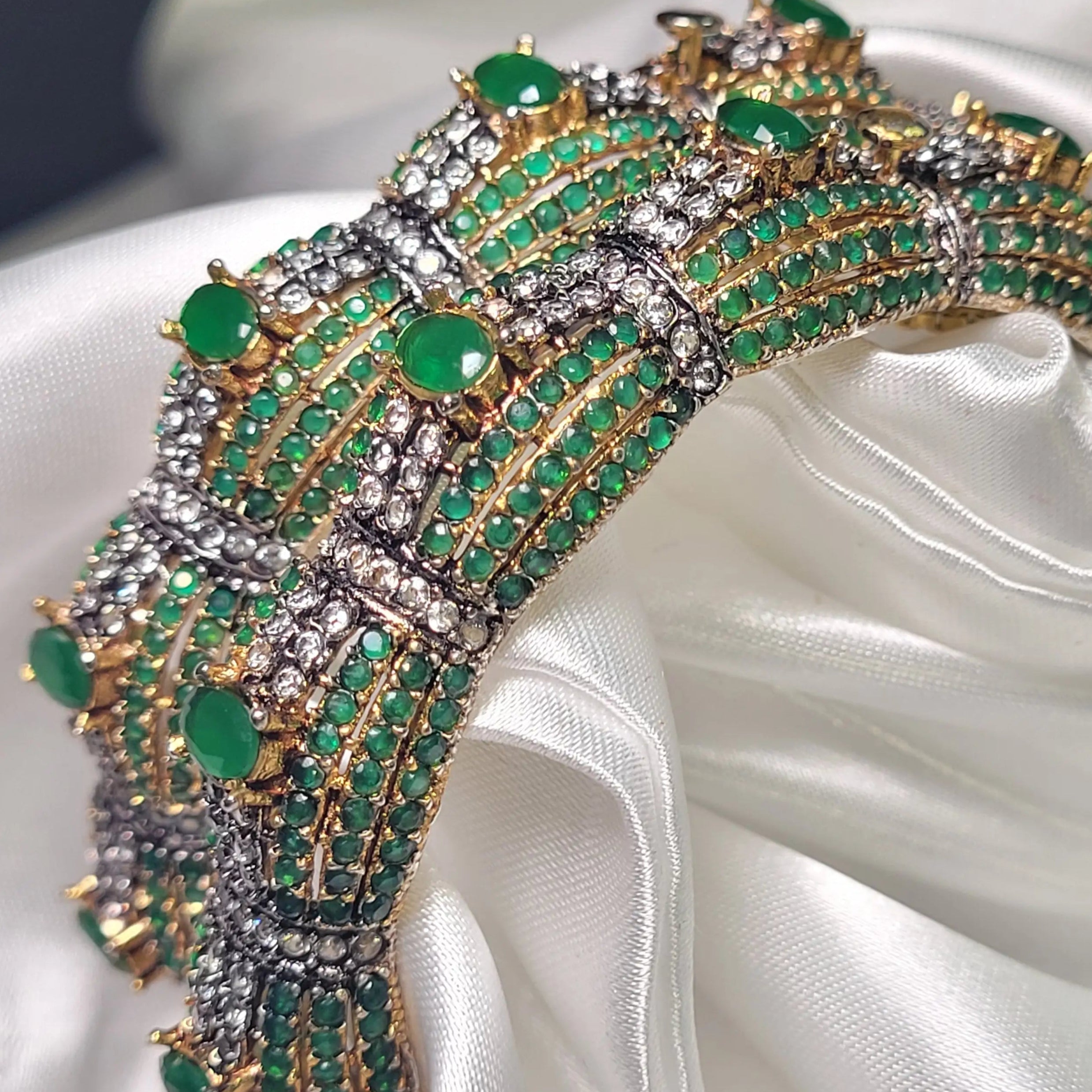 Statement openable bangles with emerald accents and micro pave setting – top view