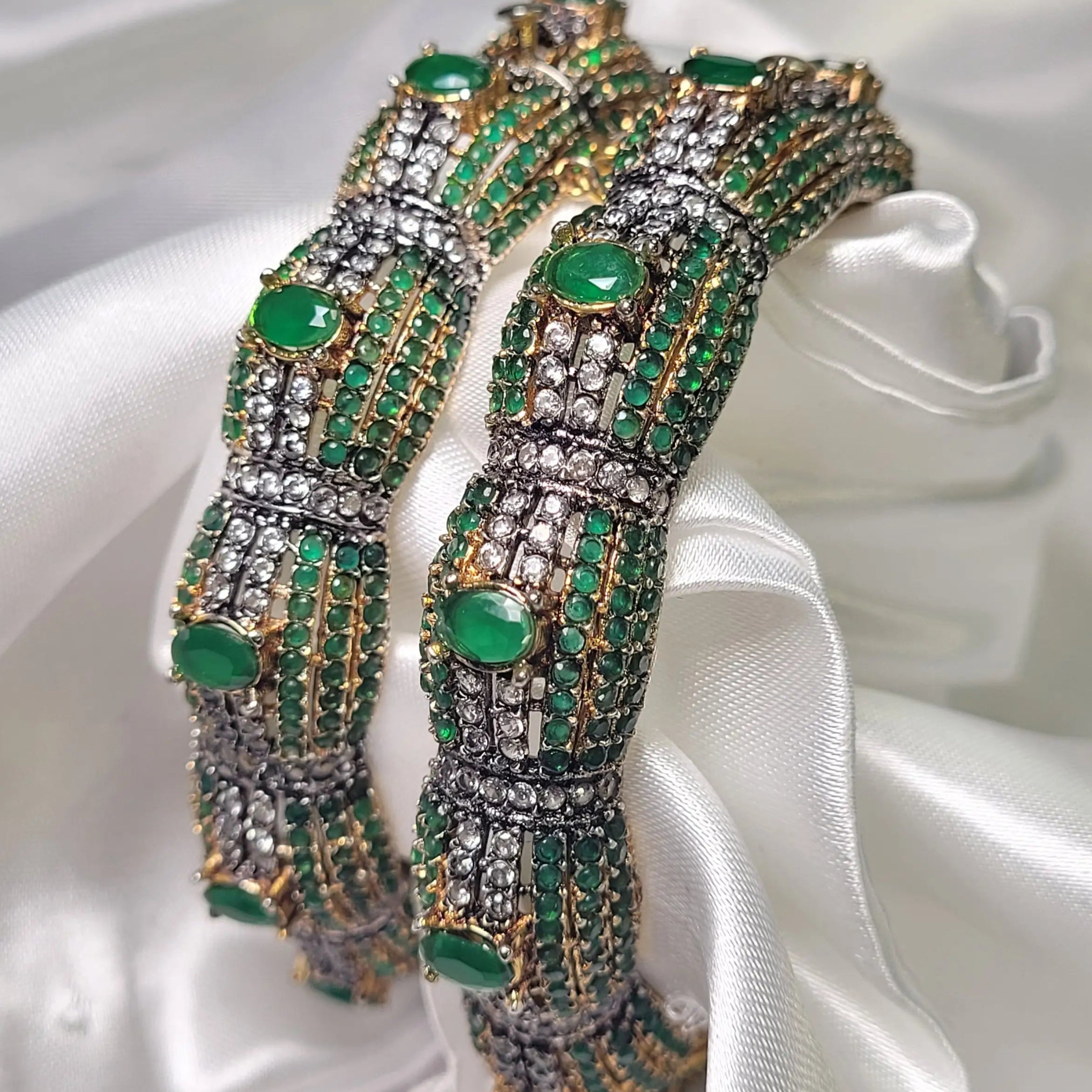 Royal style CZ-encrusted green bangles with hinged clasp – angled display