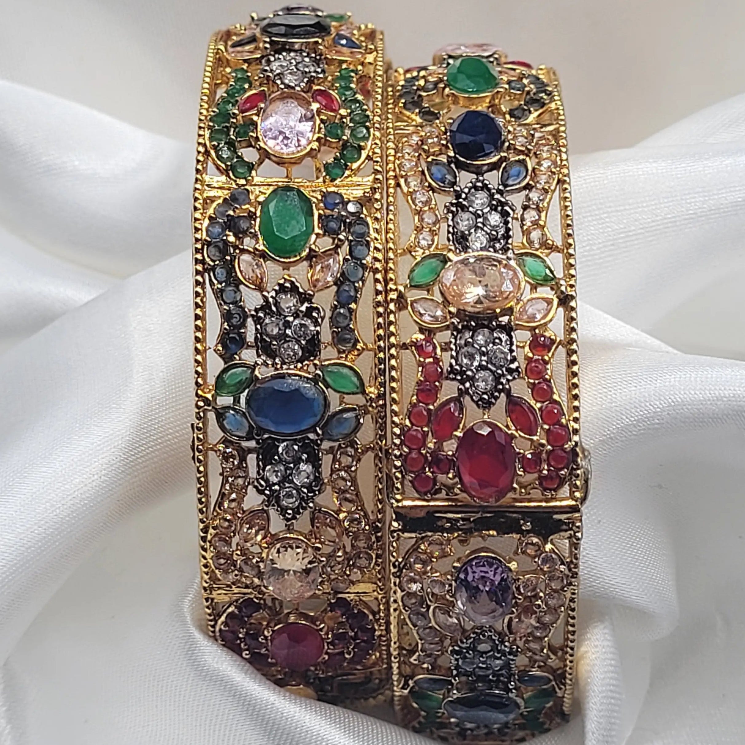 Colorful gemstone bangles with CZ detailing and gold finish – close-up