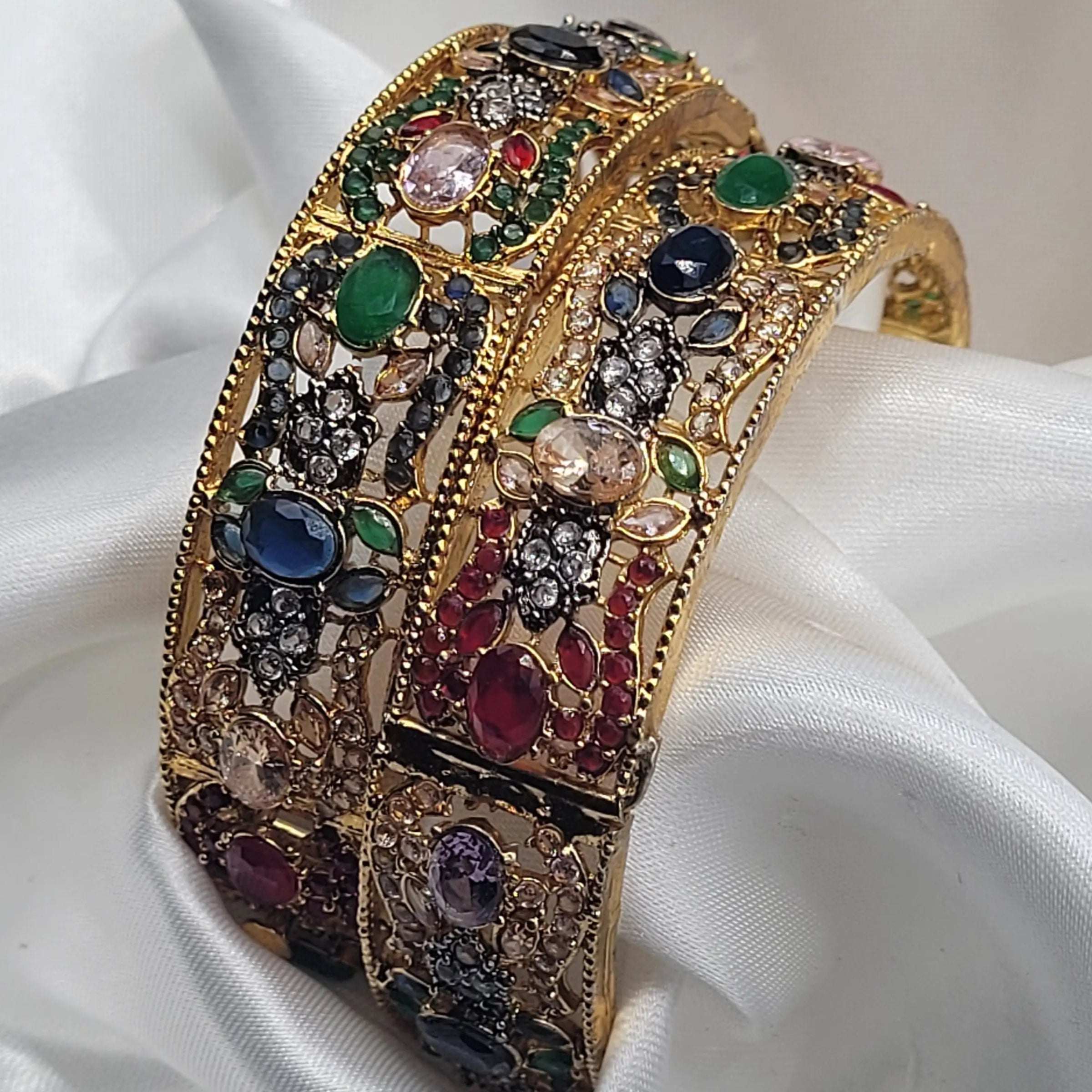 Multicolor openable bangles featuring vibrant stone combinations – angled view