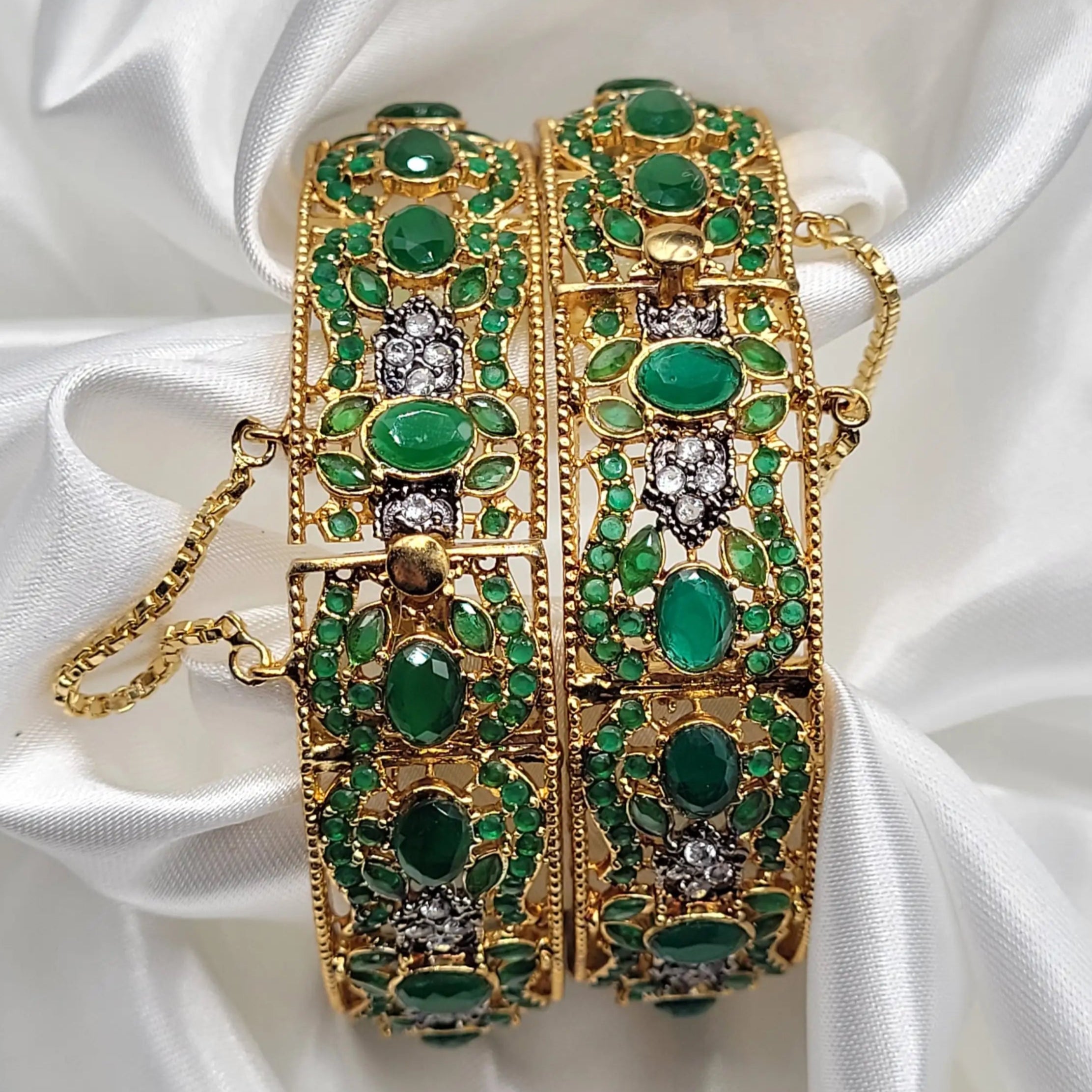 JV3015 green openable bangles with emerald CZ stones and white crystal clusters – flat lay