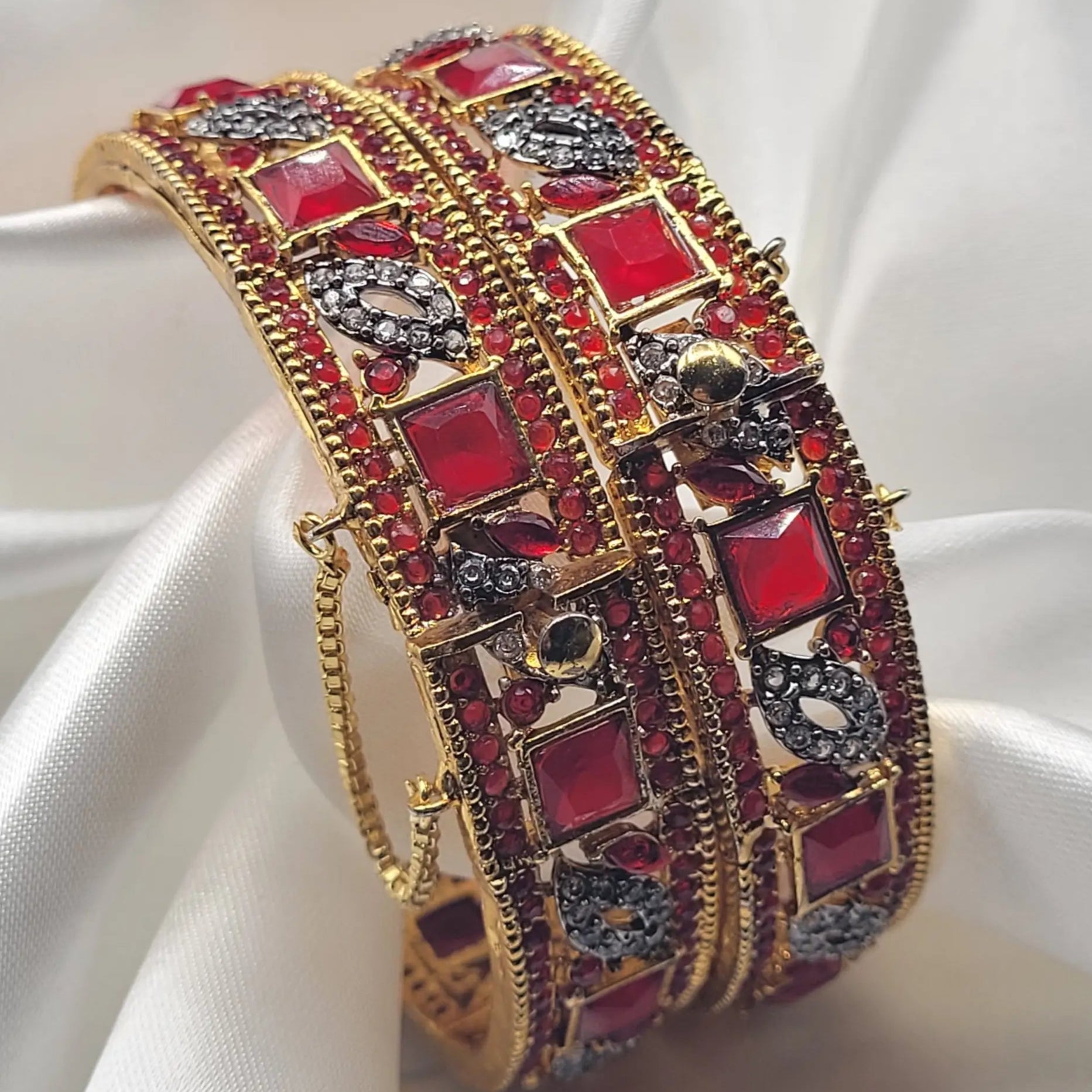 JV3016 ruby red openable bangles with CZ accents – angled view