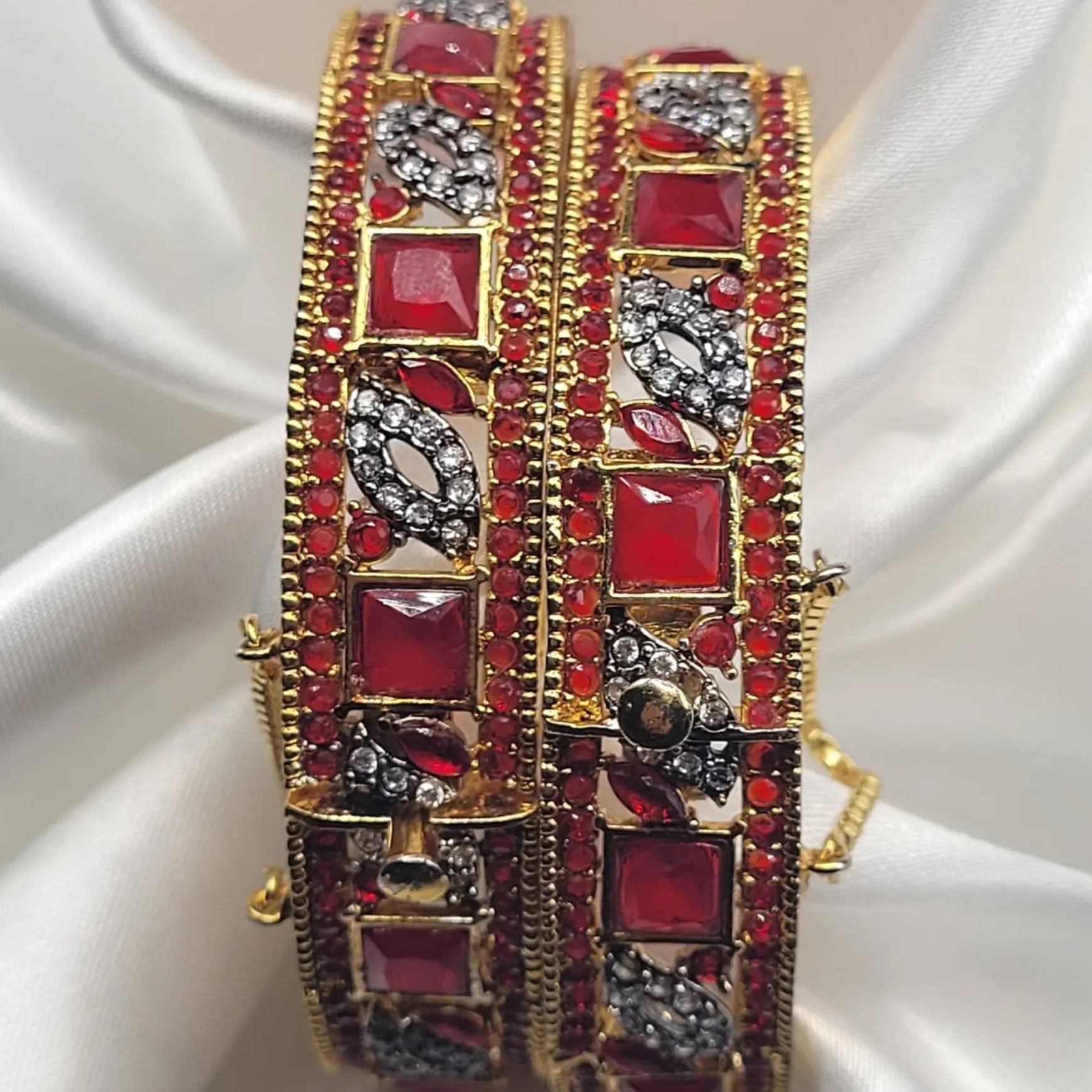 Red bridal bangles with intricate detailing – top view
