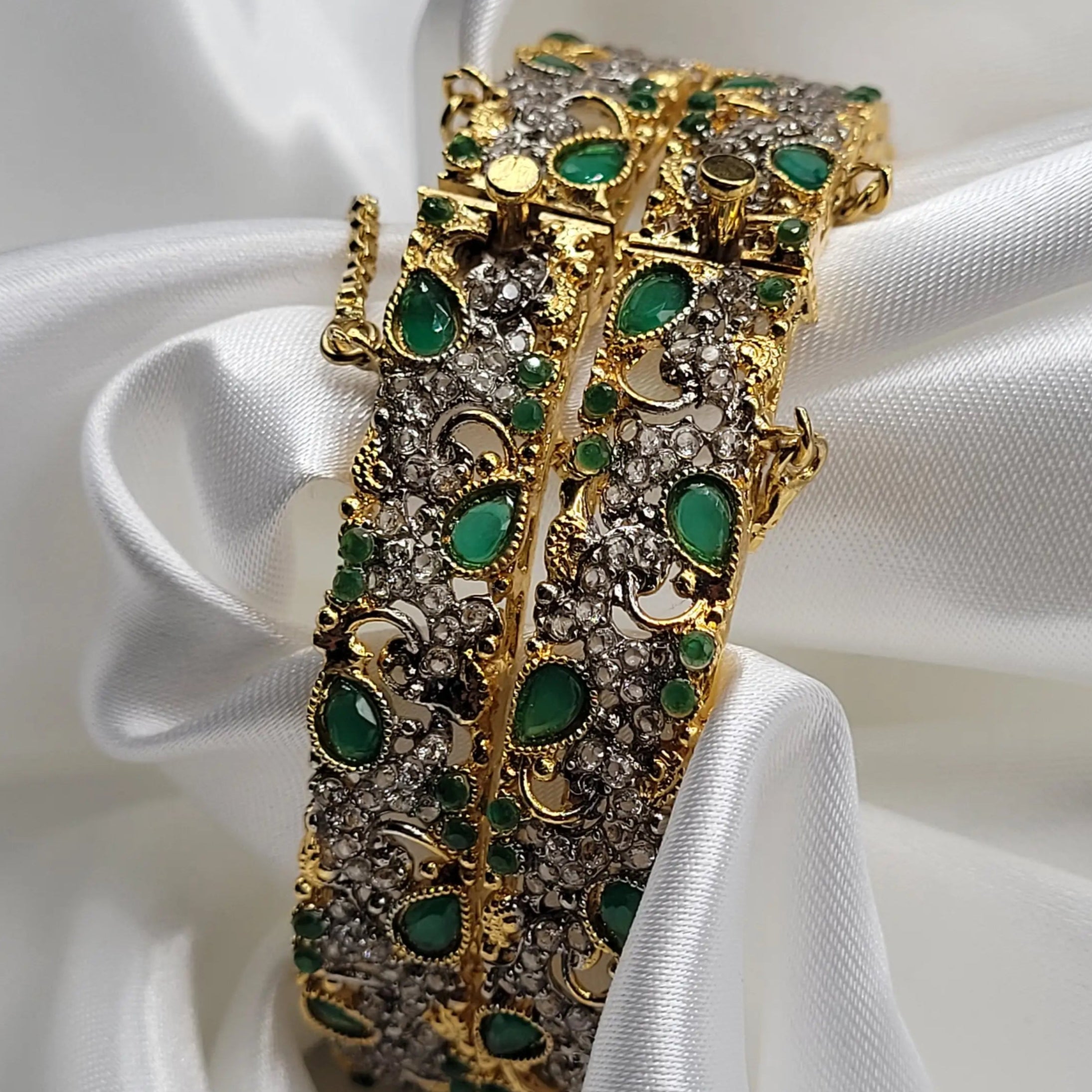 Pair of green stone bangles with intricate design – side angle
