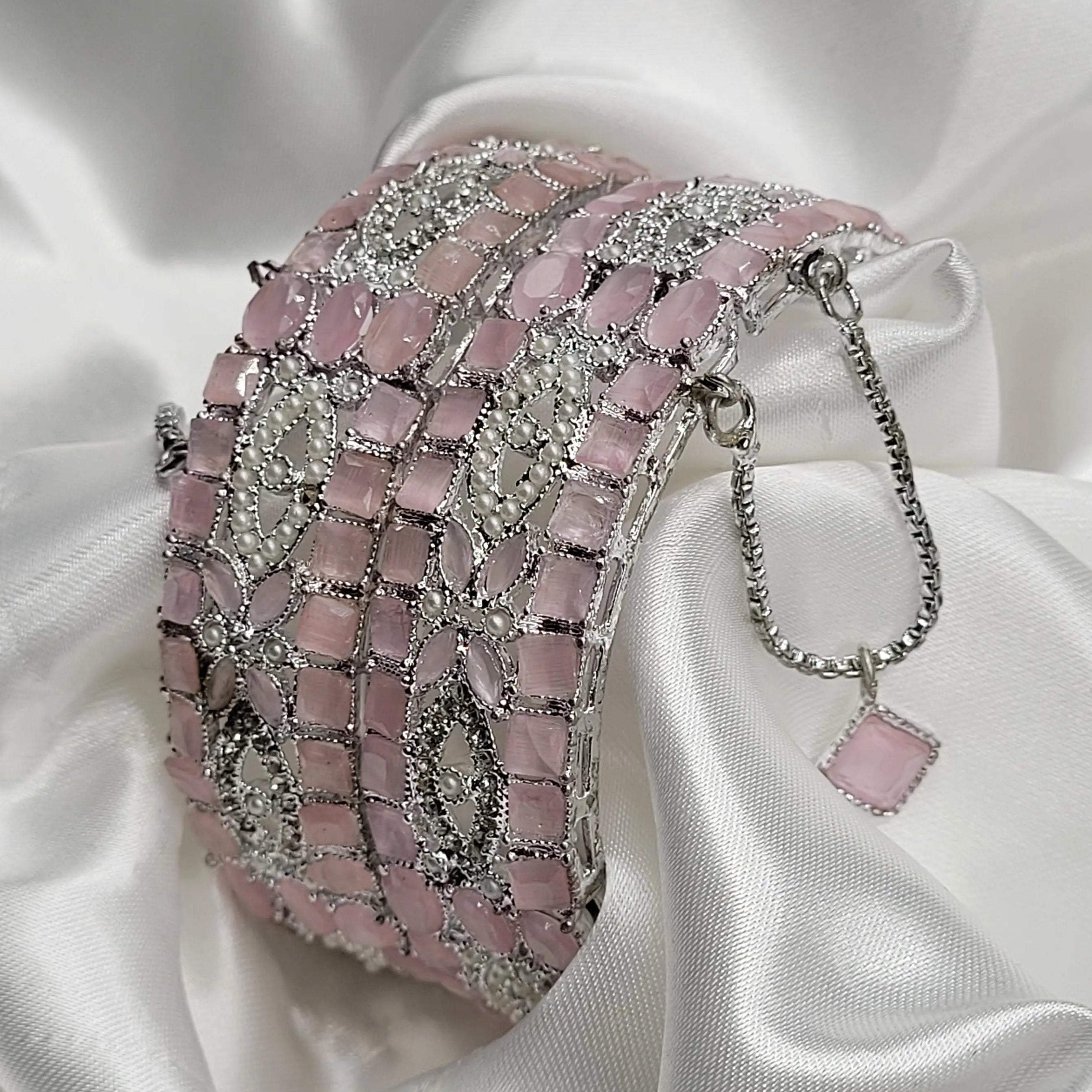 Silver-toned openable bangles with soft pink rectangular stones – side angle