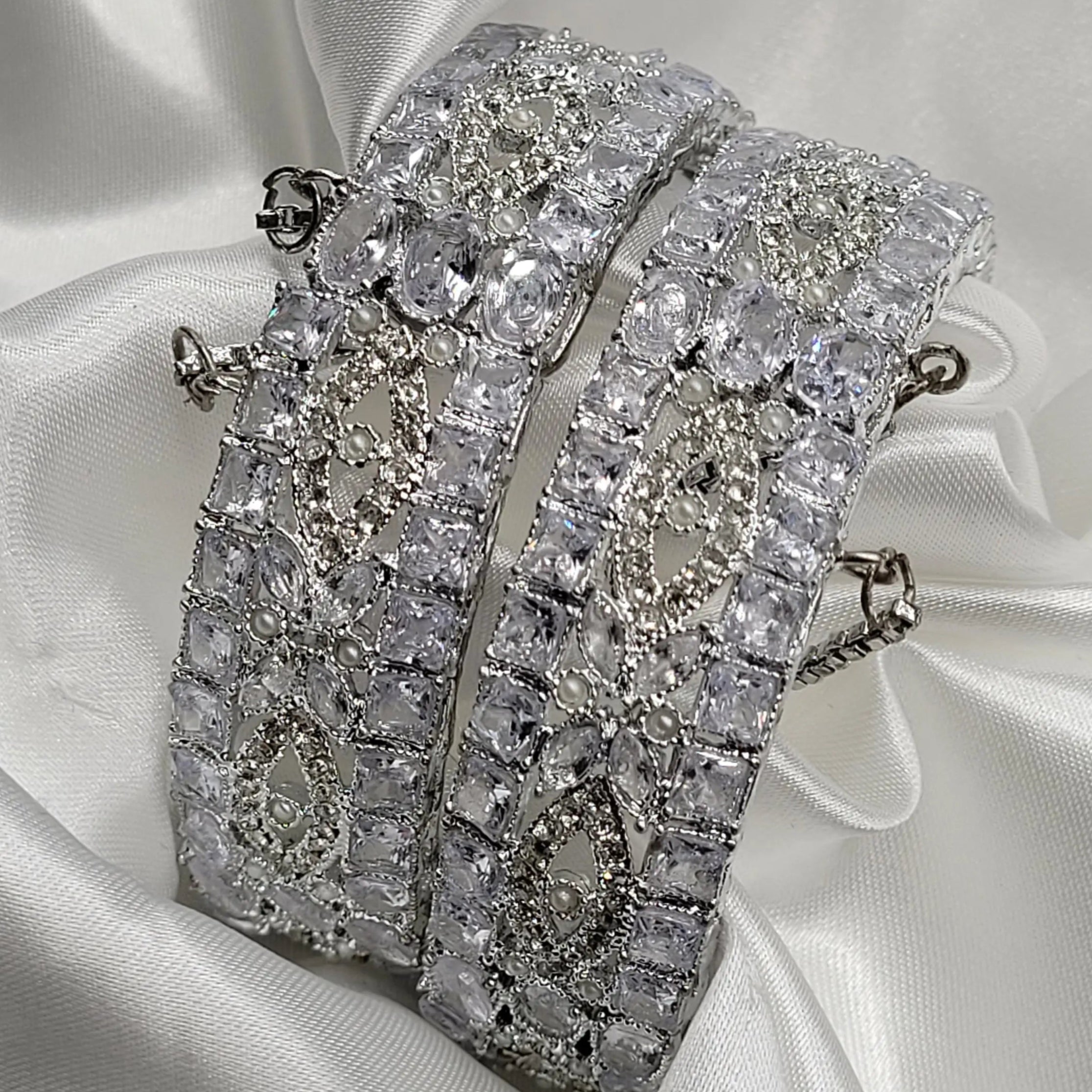 Clear stone openable bangles with intricate pattern – angled view