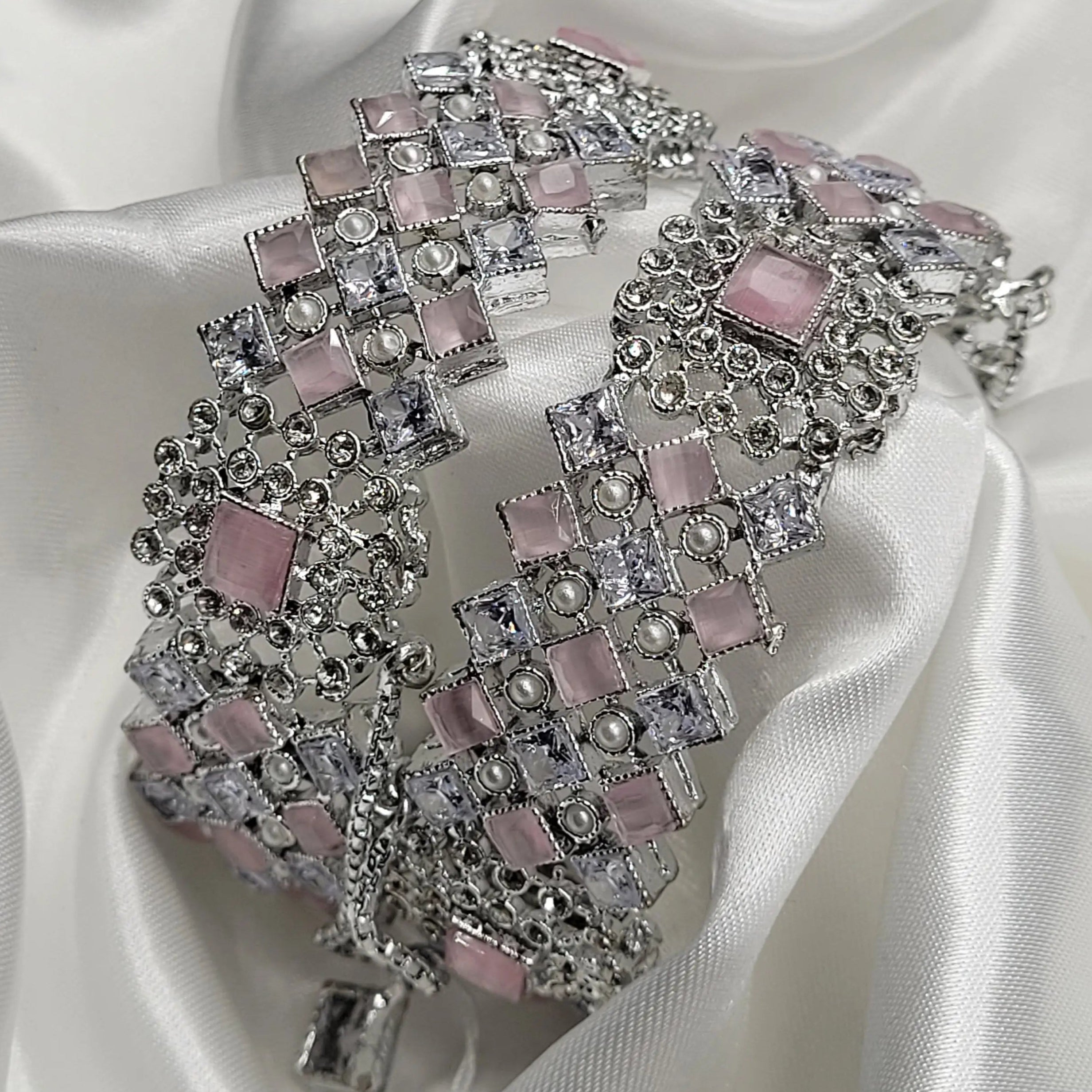 Handcrafted silver-toned bangles with checkerboard pink and white stones – side view
